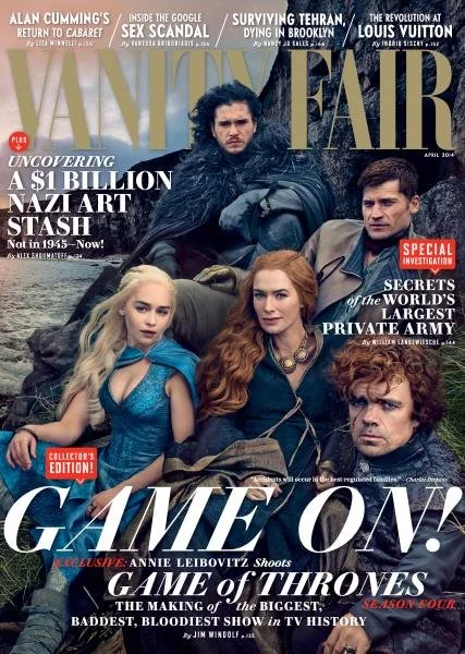 Cover of Vanity Fair magazine, April 2004 issue, featuring characters from Game of Thrones. Four characters in costume sitting on rocks, with a backdrop of a rocky landscape. Text highlights include references to Alan Cumming, Nazi art stash, Tehran,
