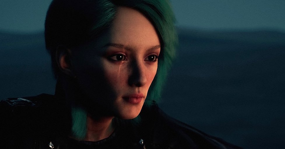 Close-up of a young woman with short, styled hair, looking off into the distance with a serious expression