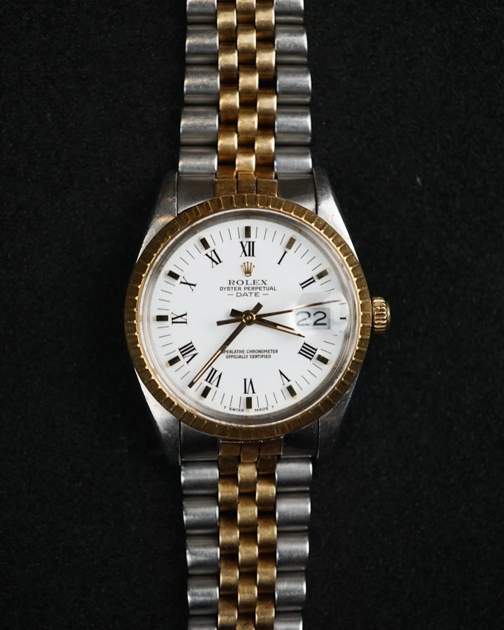 Beautiful 1987 Rolex Date &mdash; This standout piece features a striking enamel-like Roman numeral dial that truly sets it apart. Powered by the dependable quickset Caliber 3035 movement, it delivers both precision and everyday convenience. Complete