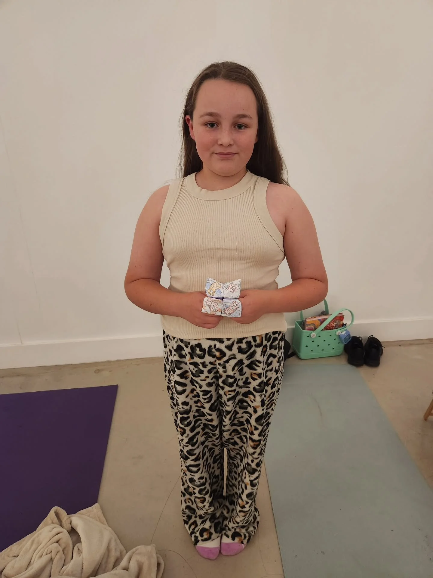 Oh, hi Pippa 👋👋. 

Pippa has jumped straight into Little Zens this term, soaking up all its magic ✨️. 

Having completed her Chatta Box (the colourful paper creation in her hands), which enables Pippa to explore fun ways to regulate her emotions an
