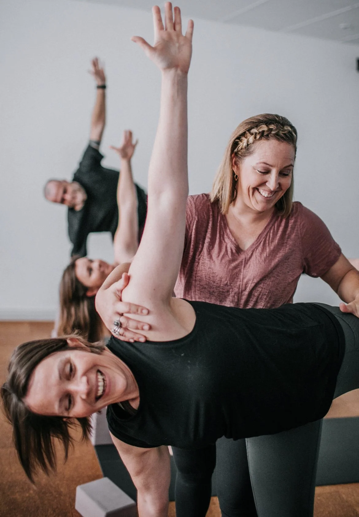 Senior Yoga Teacher guiding students in a Kingsley yoga class