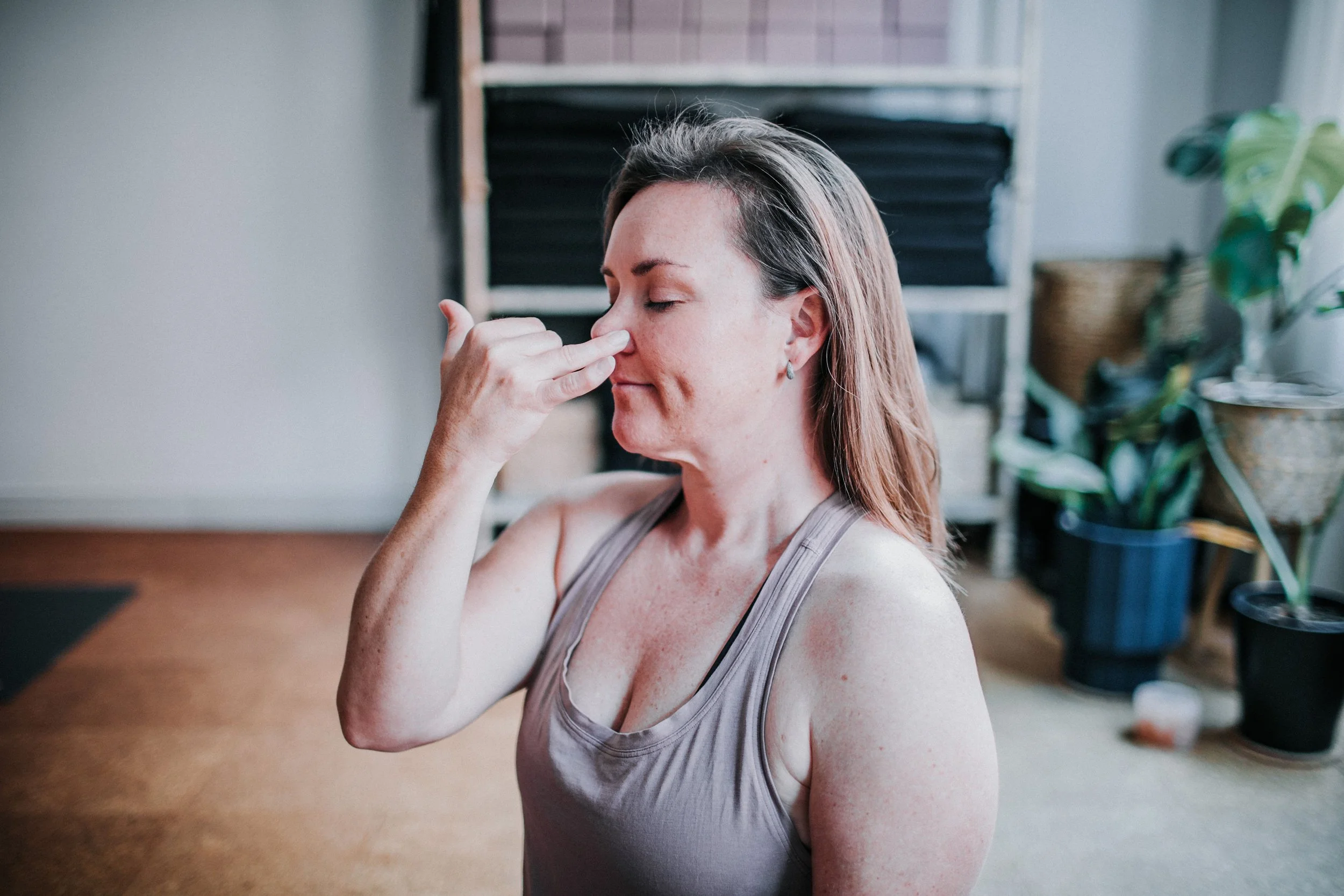 woman practicing breathwork in a Perth yoga studio