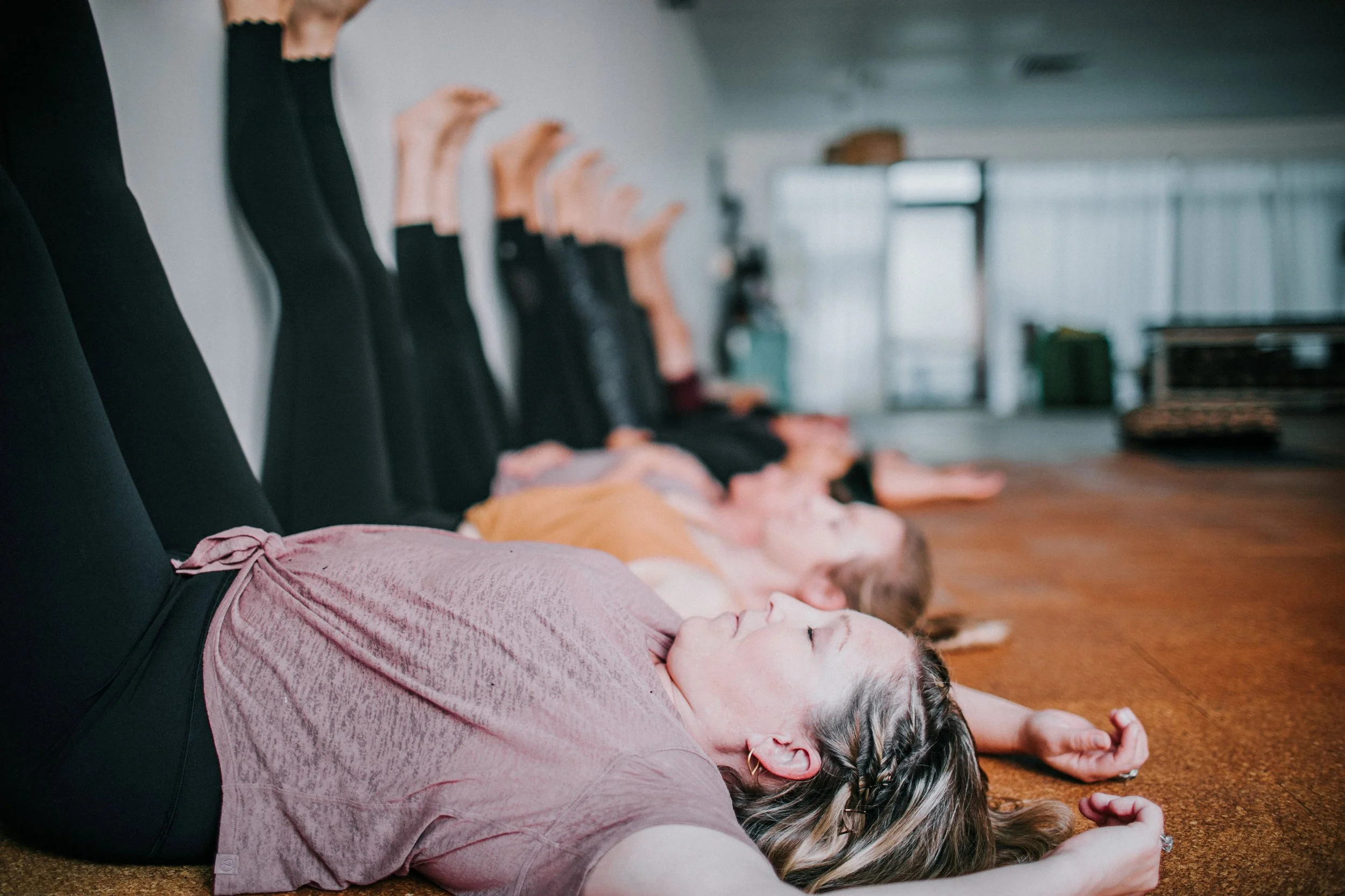 women practicing restorative yoga postures in a boutique perth yoga studio in Kingsley
