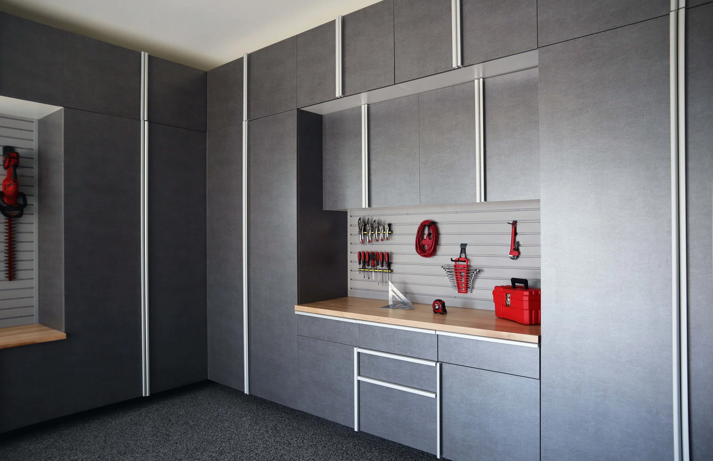 Pewter Cabinets with Butcher Block Countertop and Grey Slatwall.jpg