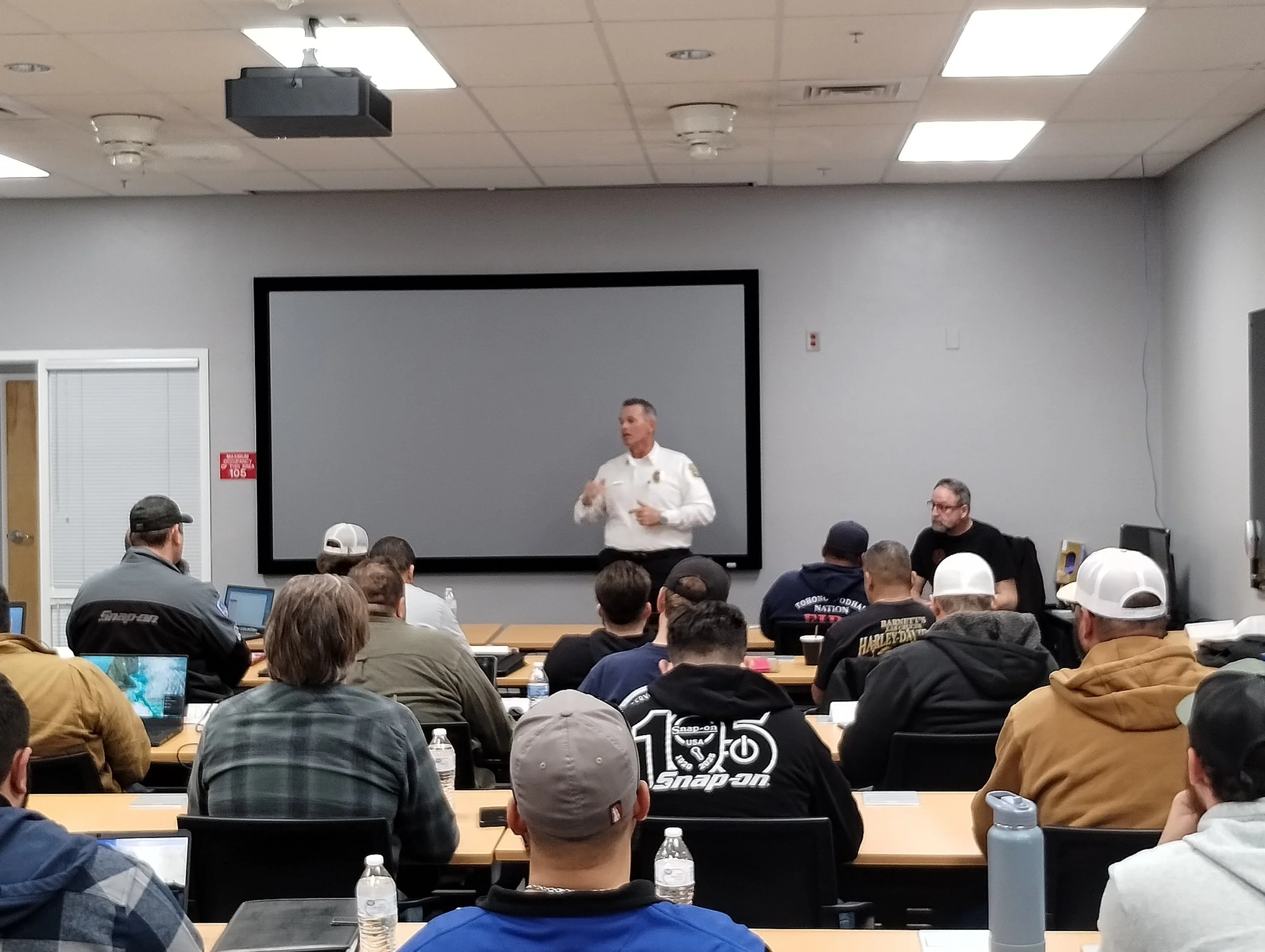 The assistant fire chief welcomes a room full of Emergency Vehicle Technicians to a full day of ASE A9 training by Tony Martin.