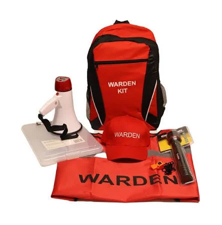First aid training kit with red and black Warden backpack, megaphone in a clear plastic case, red Warden cap, Warden blanket, and flashlight in packaging.