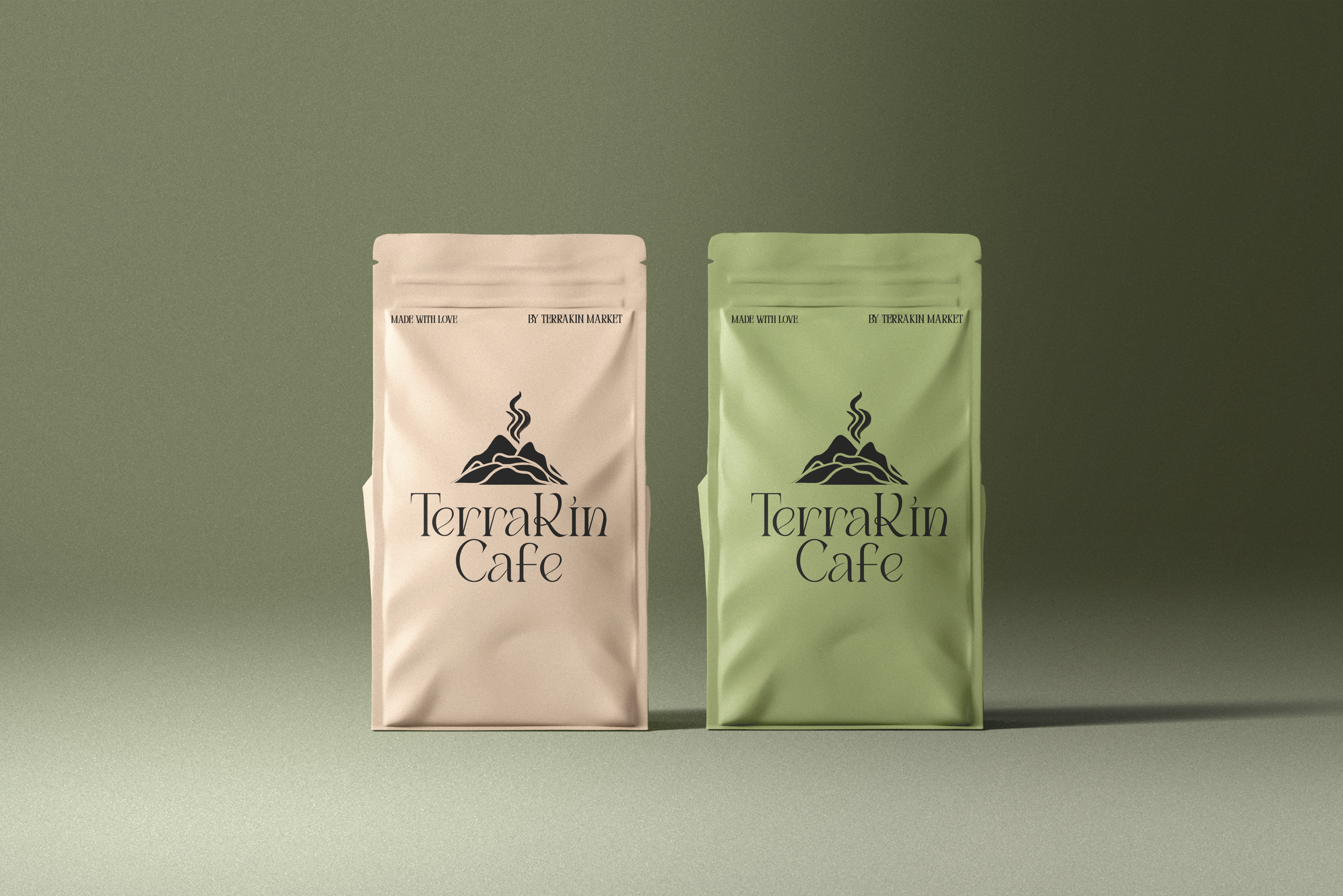 Two coffee bags with 'TerraKin Cafe' branding, one beige and one green, featuring a mountain logo.