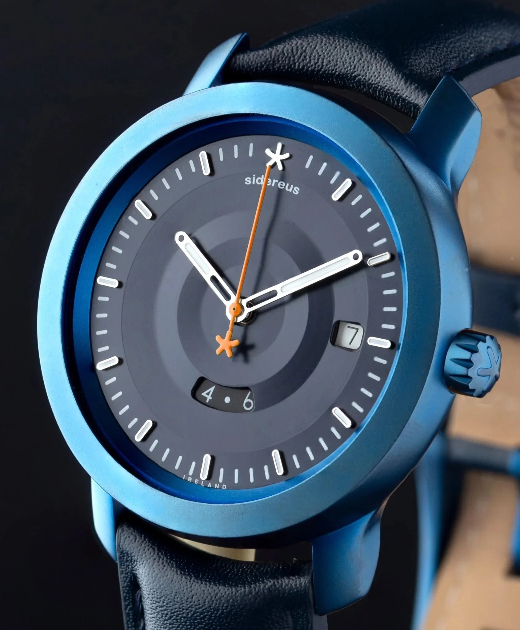 Sidereus Réalta GMT special edition watch featuring a dark blue anodised dial with concentric textures, under dial GMT display, star tipped seconds hand, and blue ion plated stainless steel case.