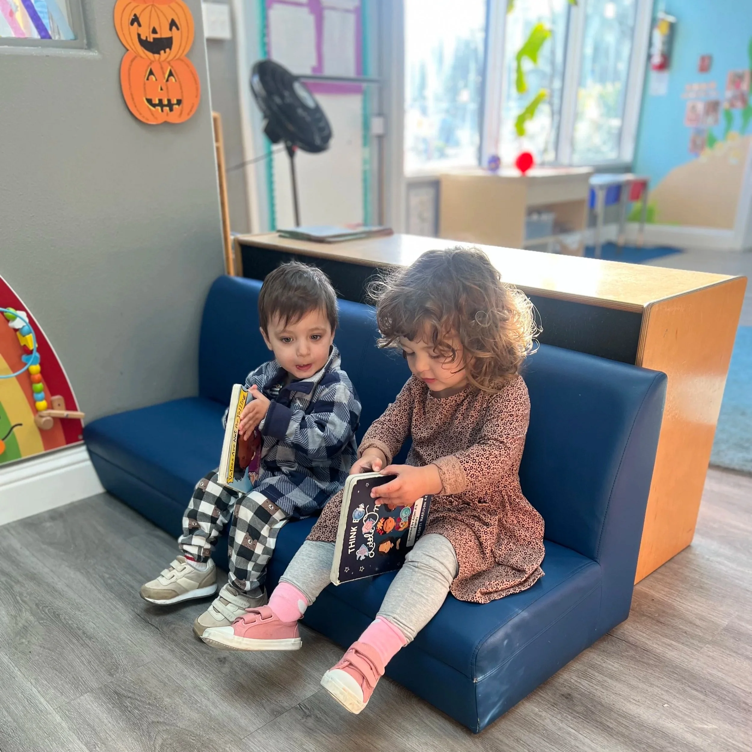 Two children reading together