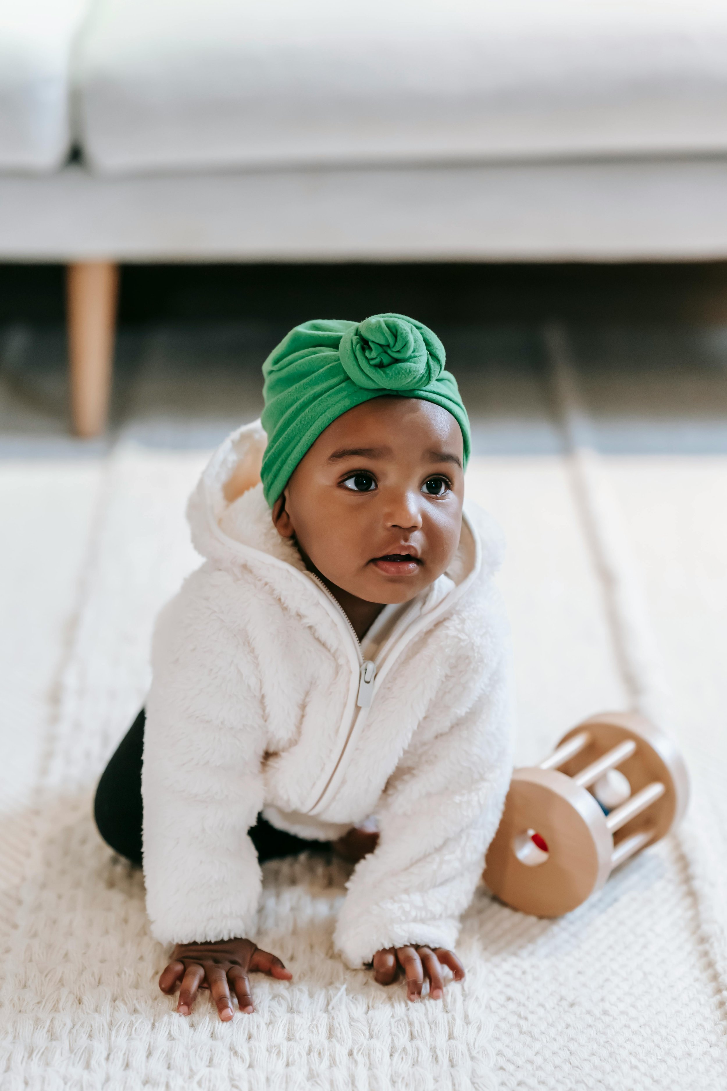 A baby playing with sensory toys