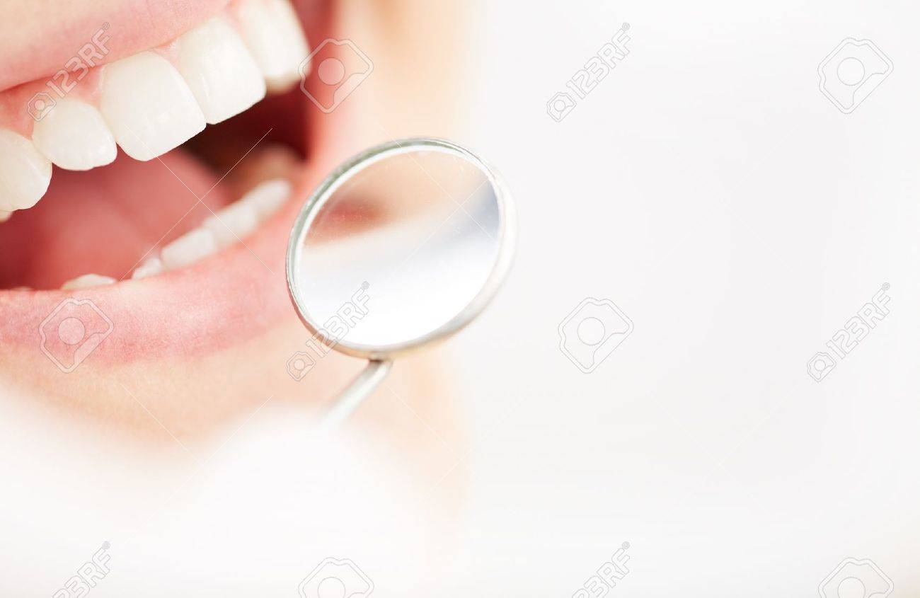 21223946-close-up-of-open-mouth-during-oral-checkup-at-the-dentists.jpg