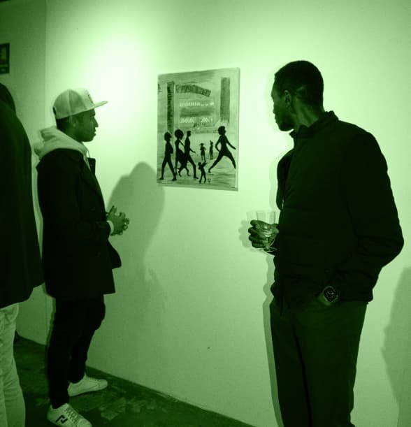 Two men observing an art piece in Afrikaleidoscope exhibit
