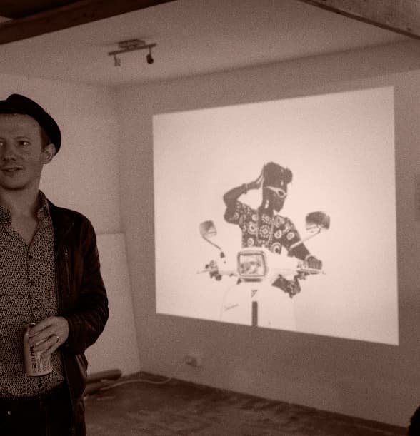 Man presenting the Harlem Project in AfrikaLeidoscope exhibit