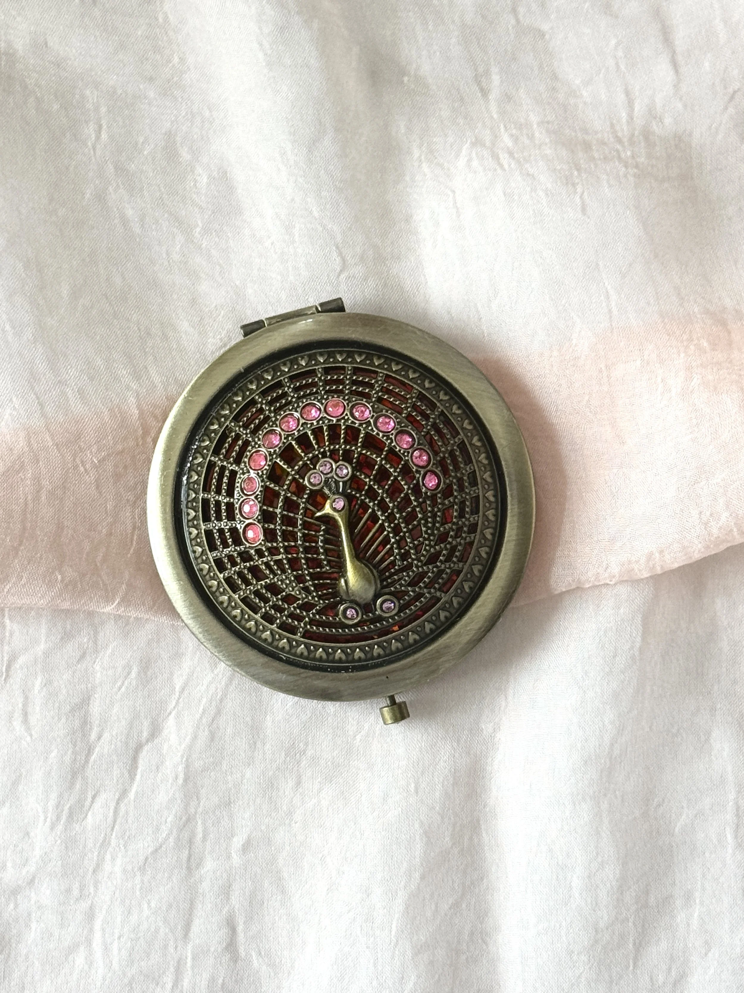 Compact Mirror featuring a dancing peacock