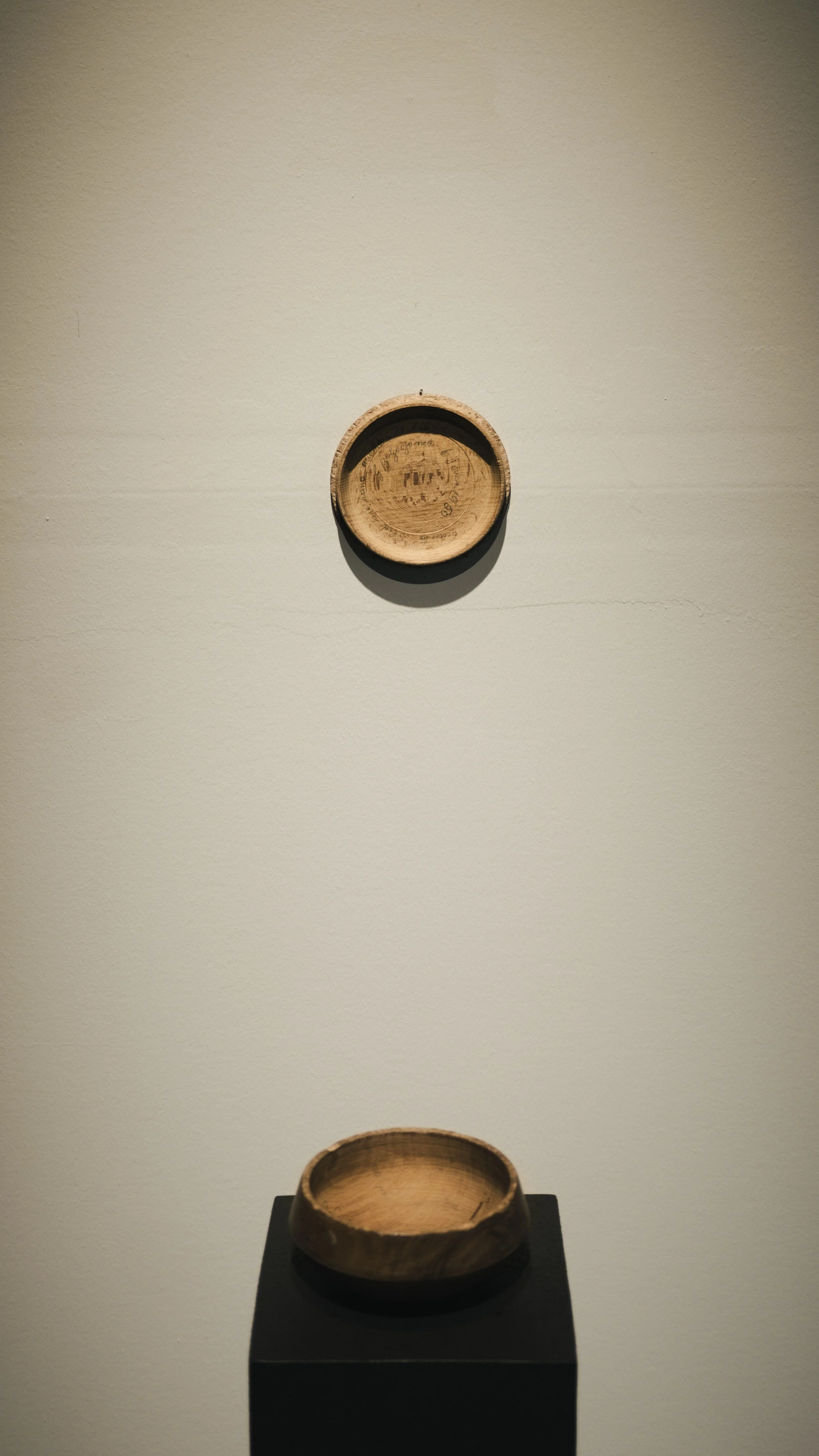 Glimpse in time,  ready-made installation, wooden bowl with a lid   made by the artist’s great-grandfather by Andrada Lolu. Photo by Daniel Truța.