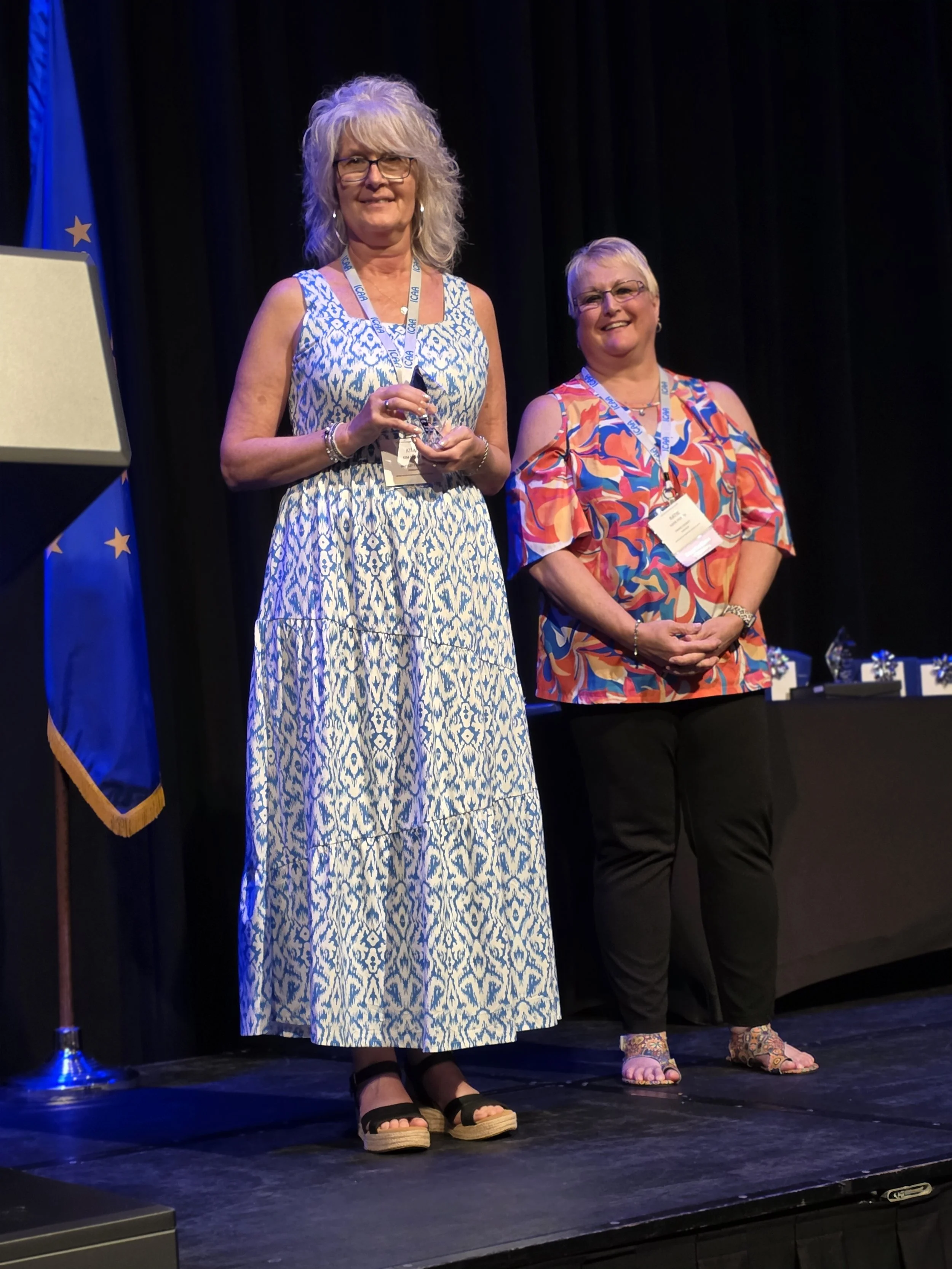 Kim Erdly, NE District receiving her award from ICAA EBOD Secretary, Kattie Potter
