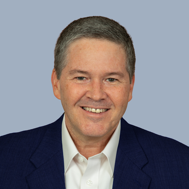 Headshot of Robert Lengacher smiling and wearing a blue blazer over a white dress shirt.