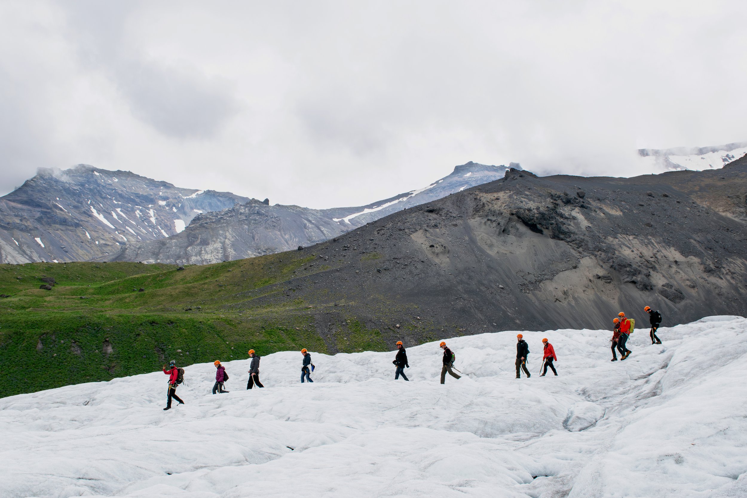 glacier walking with mountains on the background