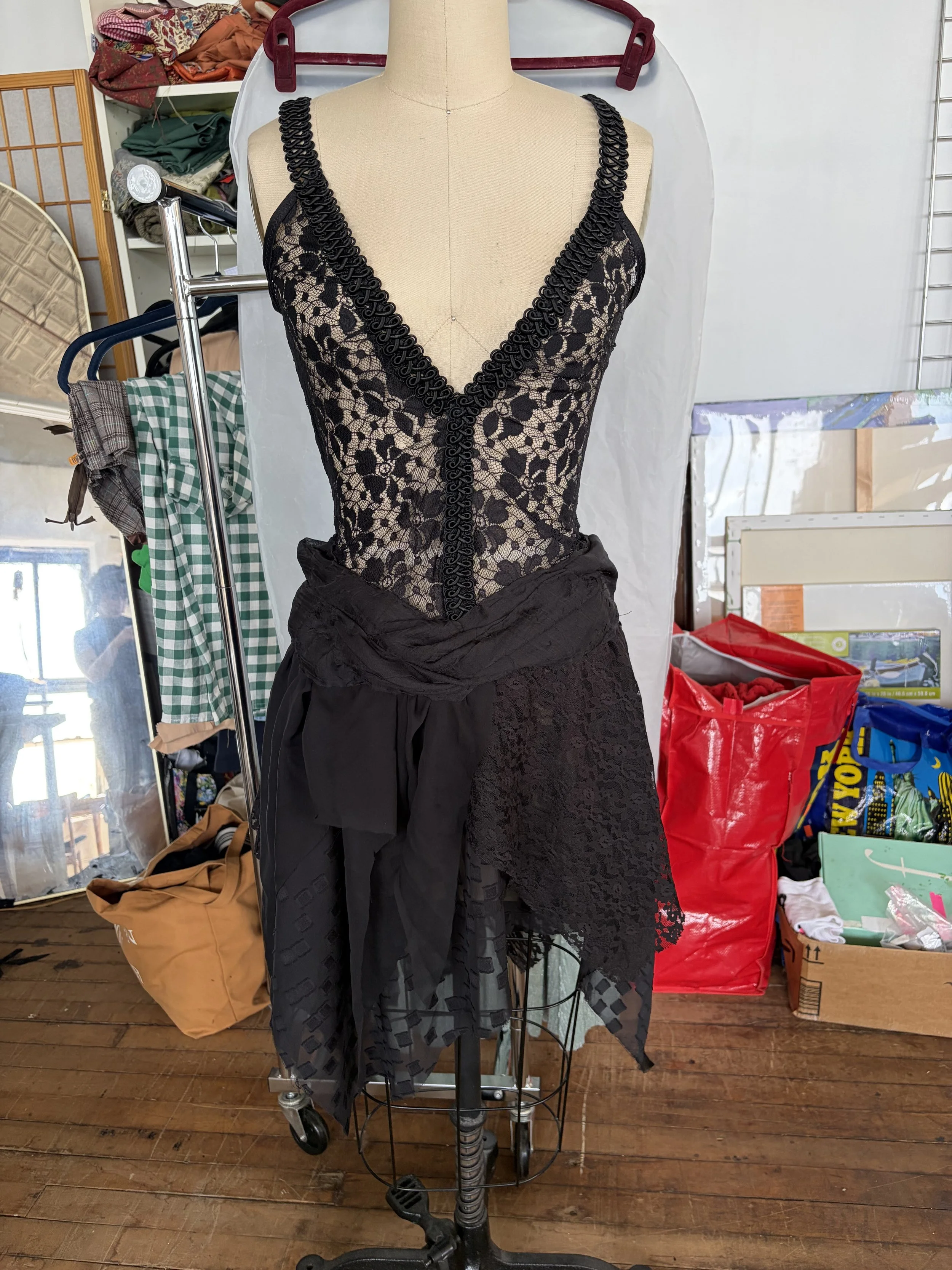 Eliza in their custom dress made from lace and other fabric scraps, vintage trim, and Japanese silk / Designed and sewn by Eliza / May 2026