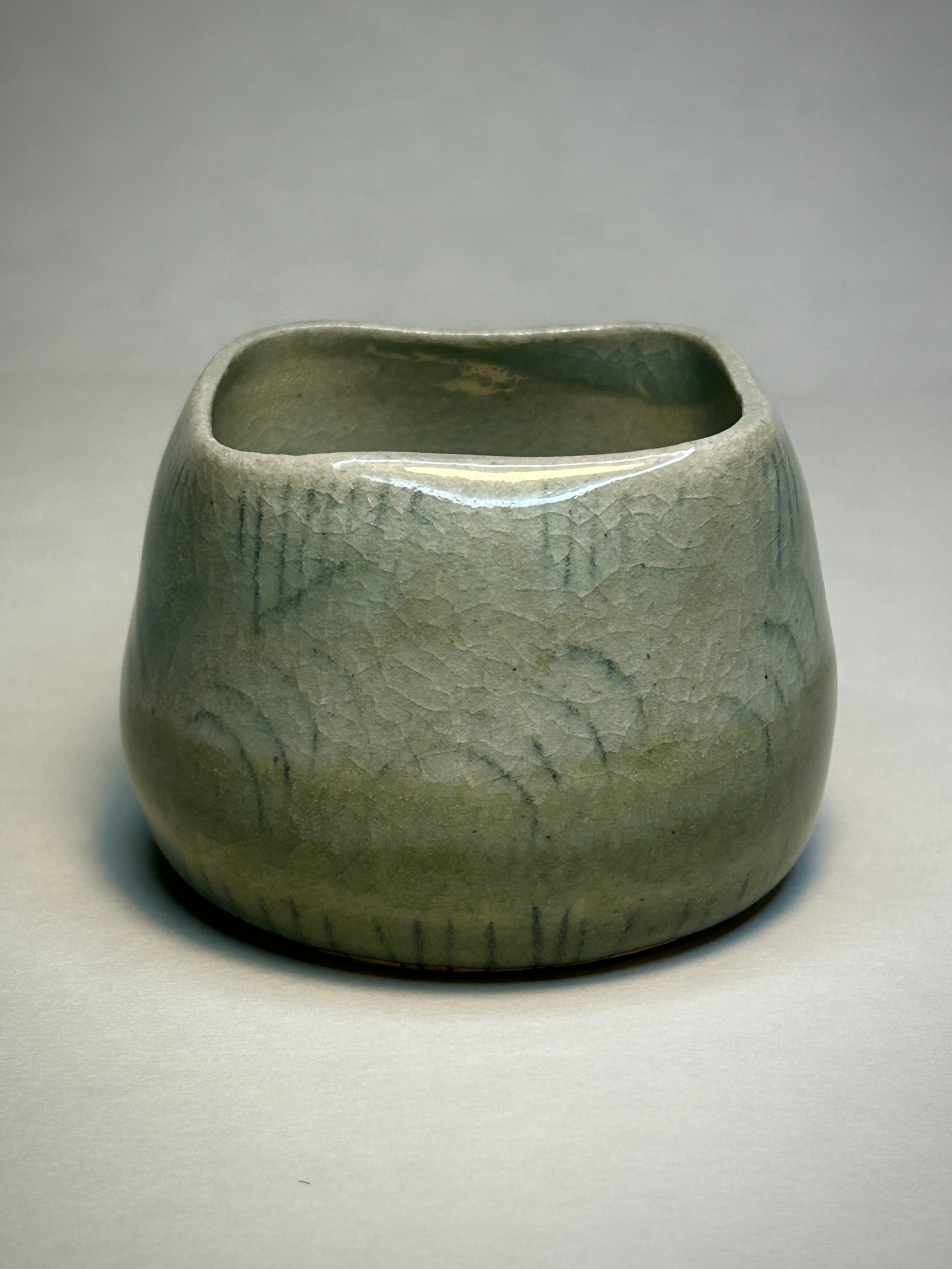 Ceramic cup in a light green crackle glaze