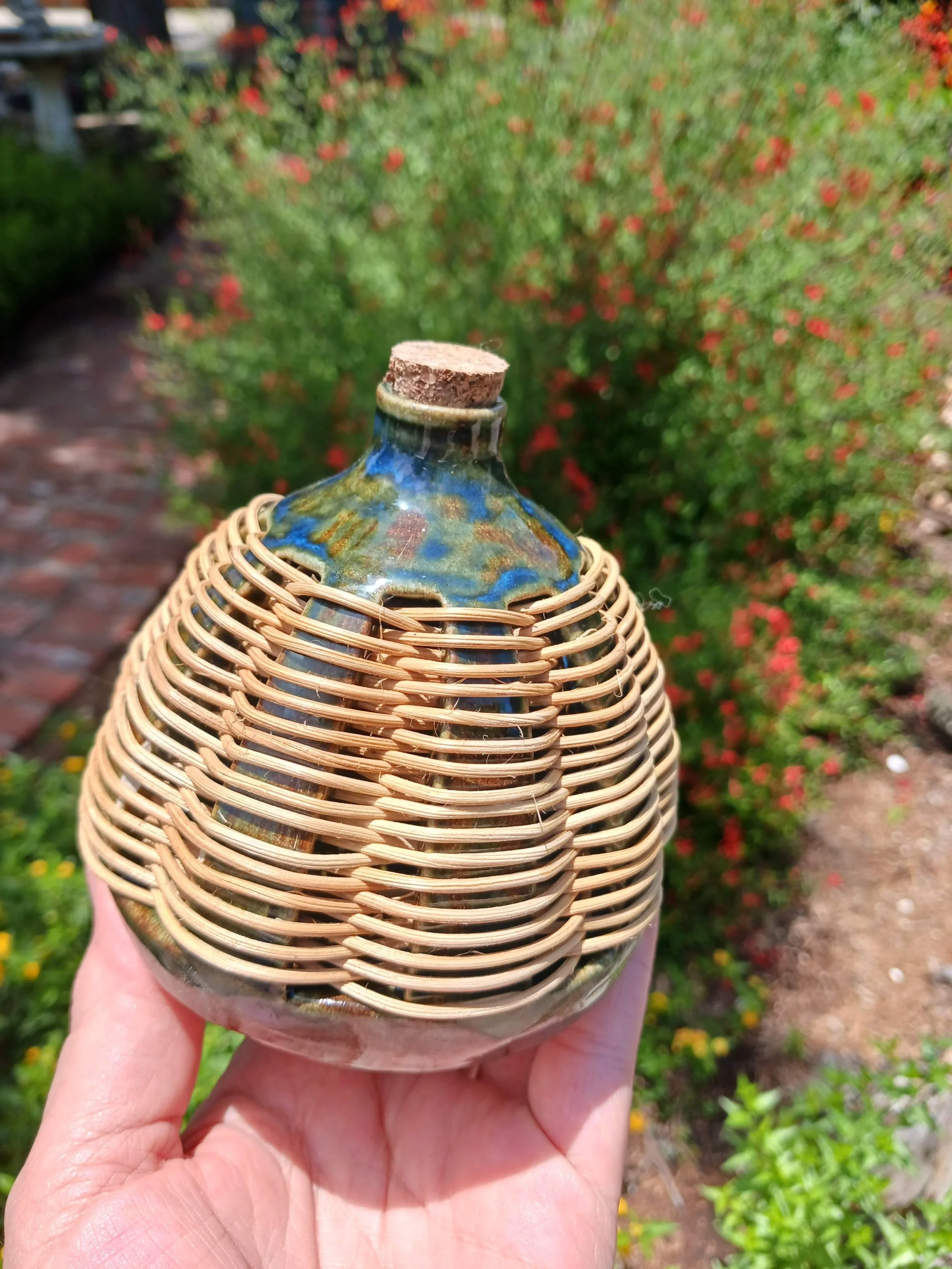 corked ceramic vase with straw weaving detail