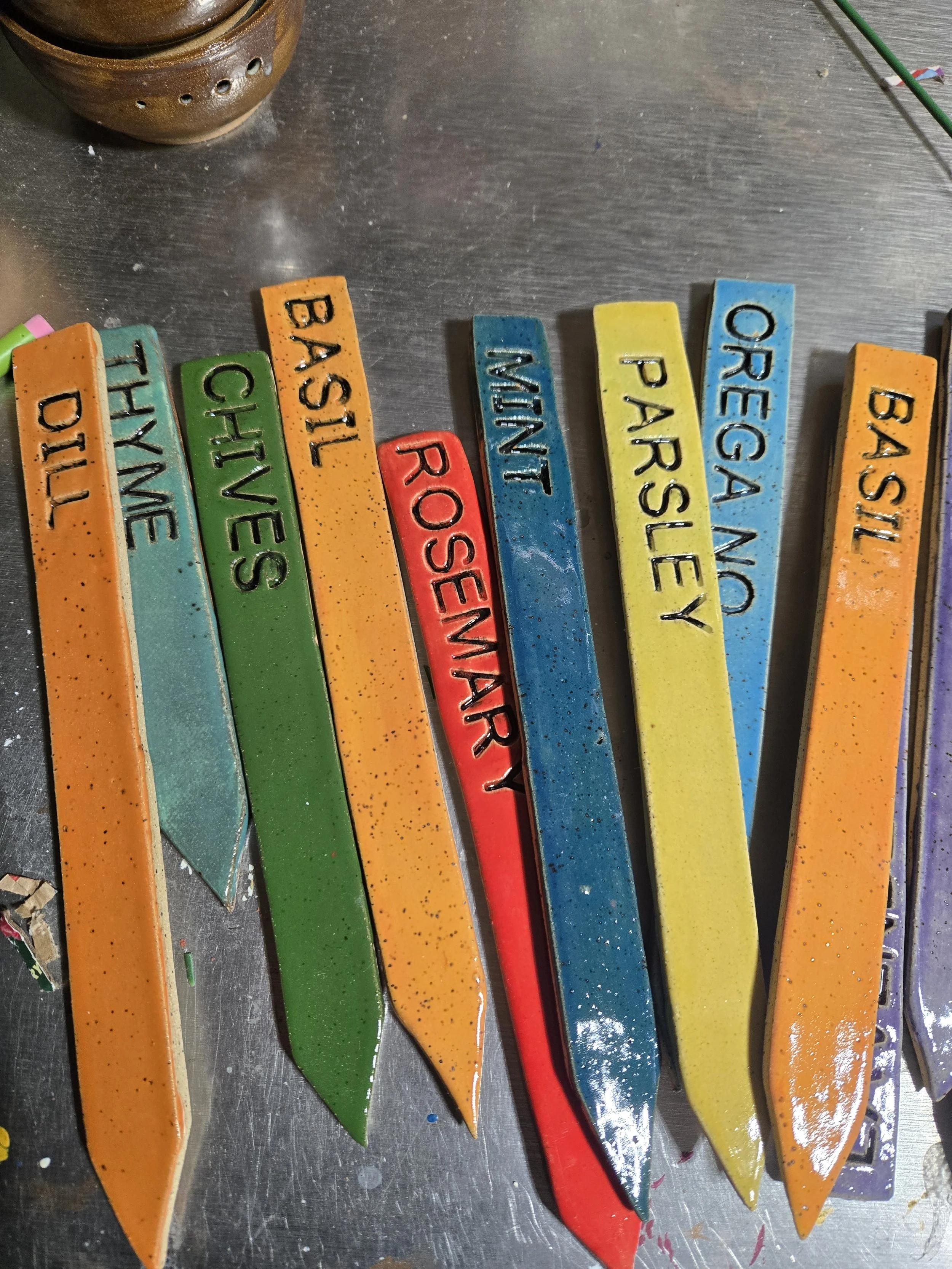Brightly colored ceramic garden stakes