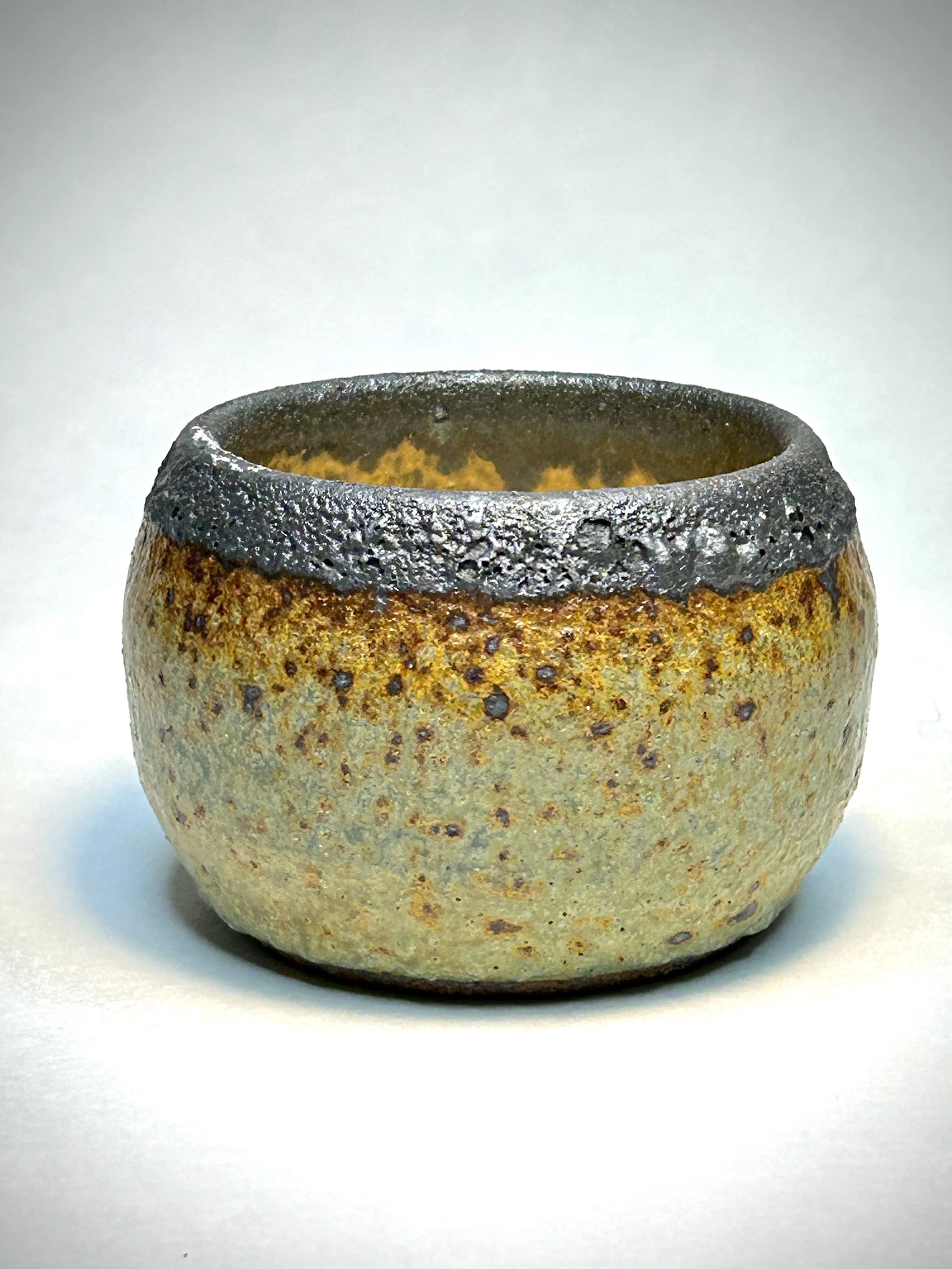 Rough ceramic vessel with reactive glaze