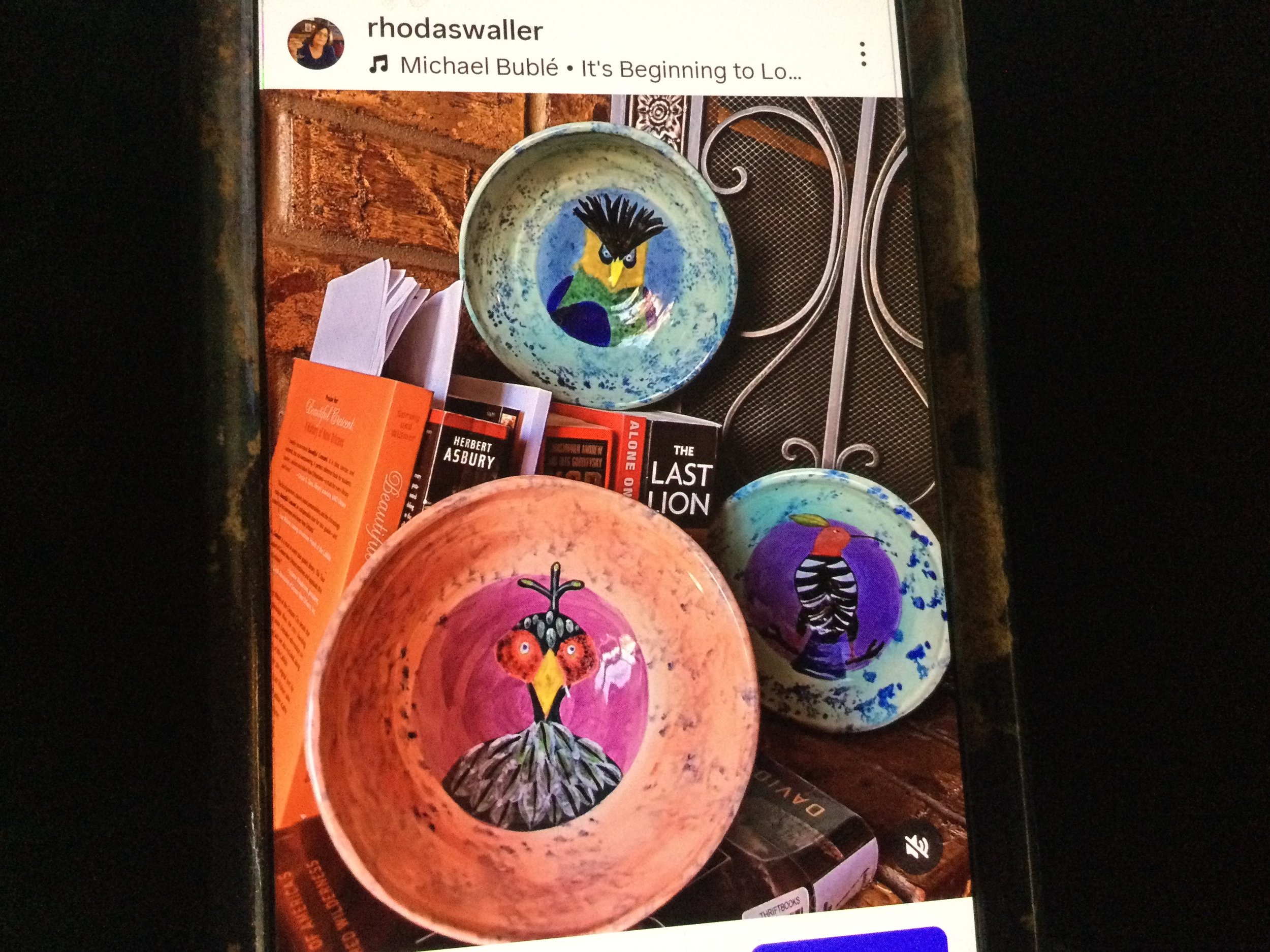 Three ceramic plates with bird designs