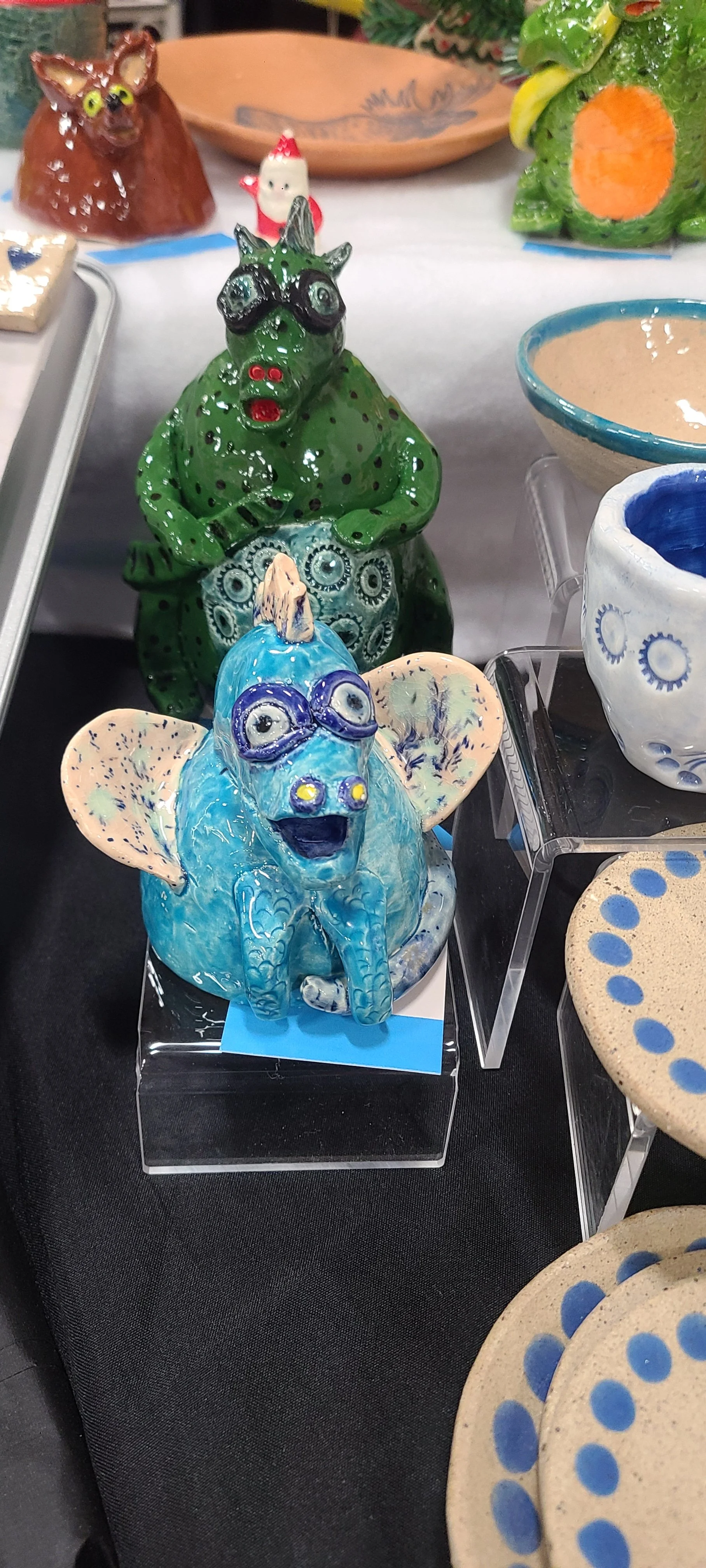 Various fantastical ceramic creatures in many colors