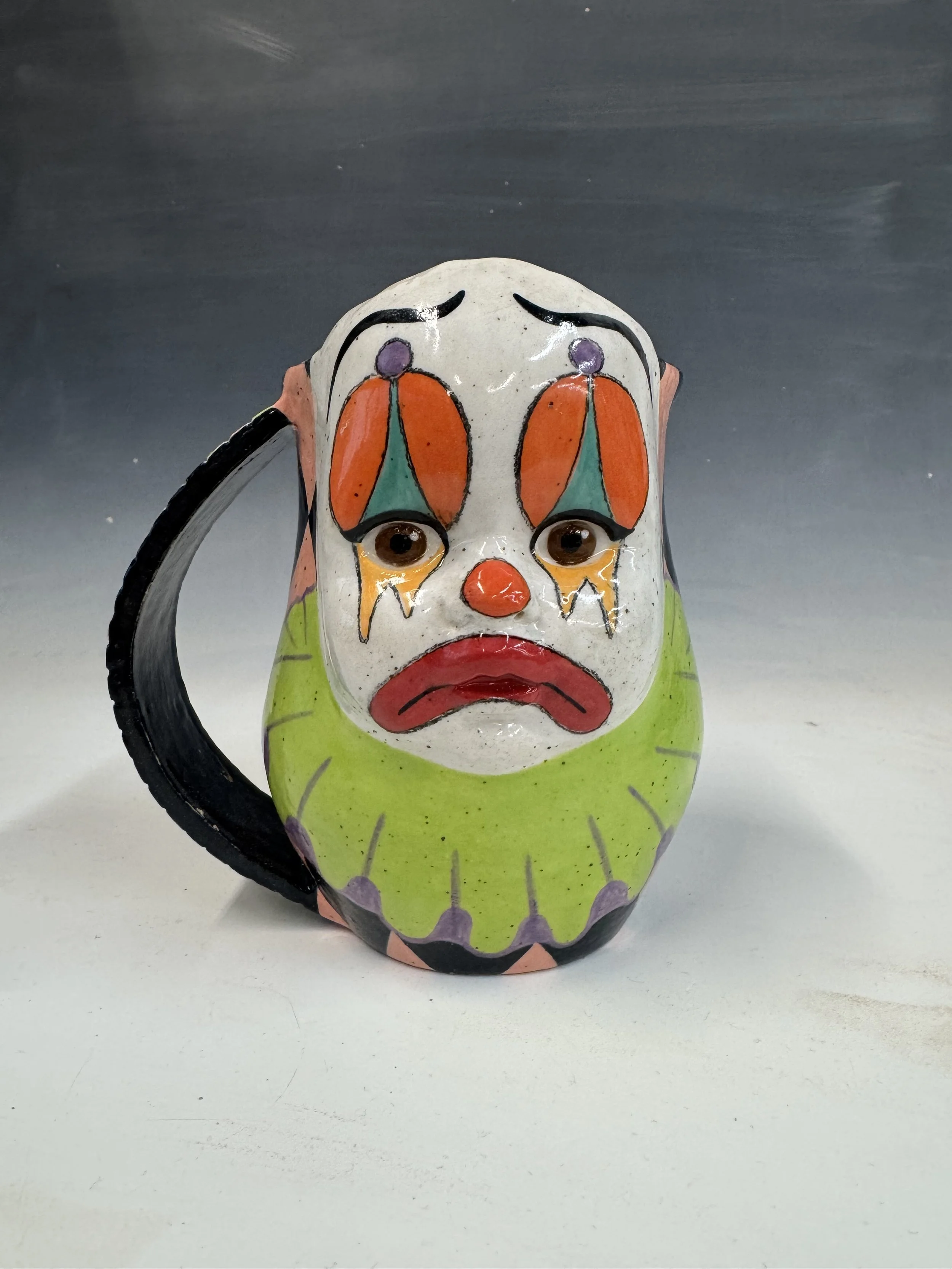 Multicolored ceramic clown cup