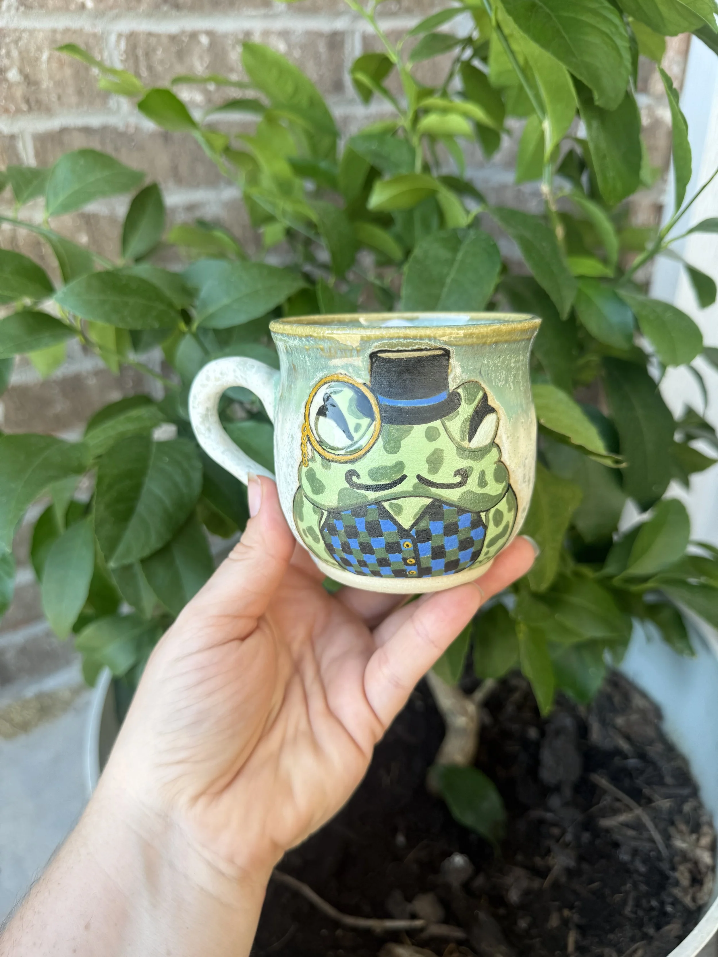Handmade Ceramic mug in greens and blues with a frog motif