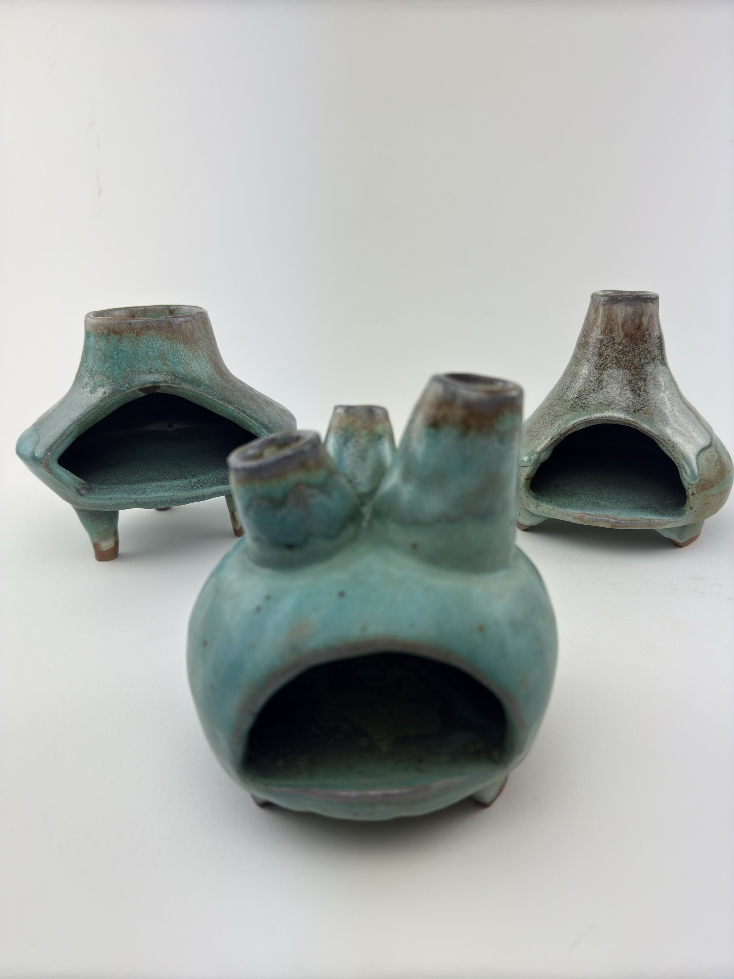 3 Turquoise glazed ceramic chimineas