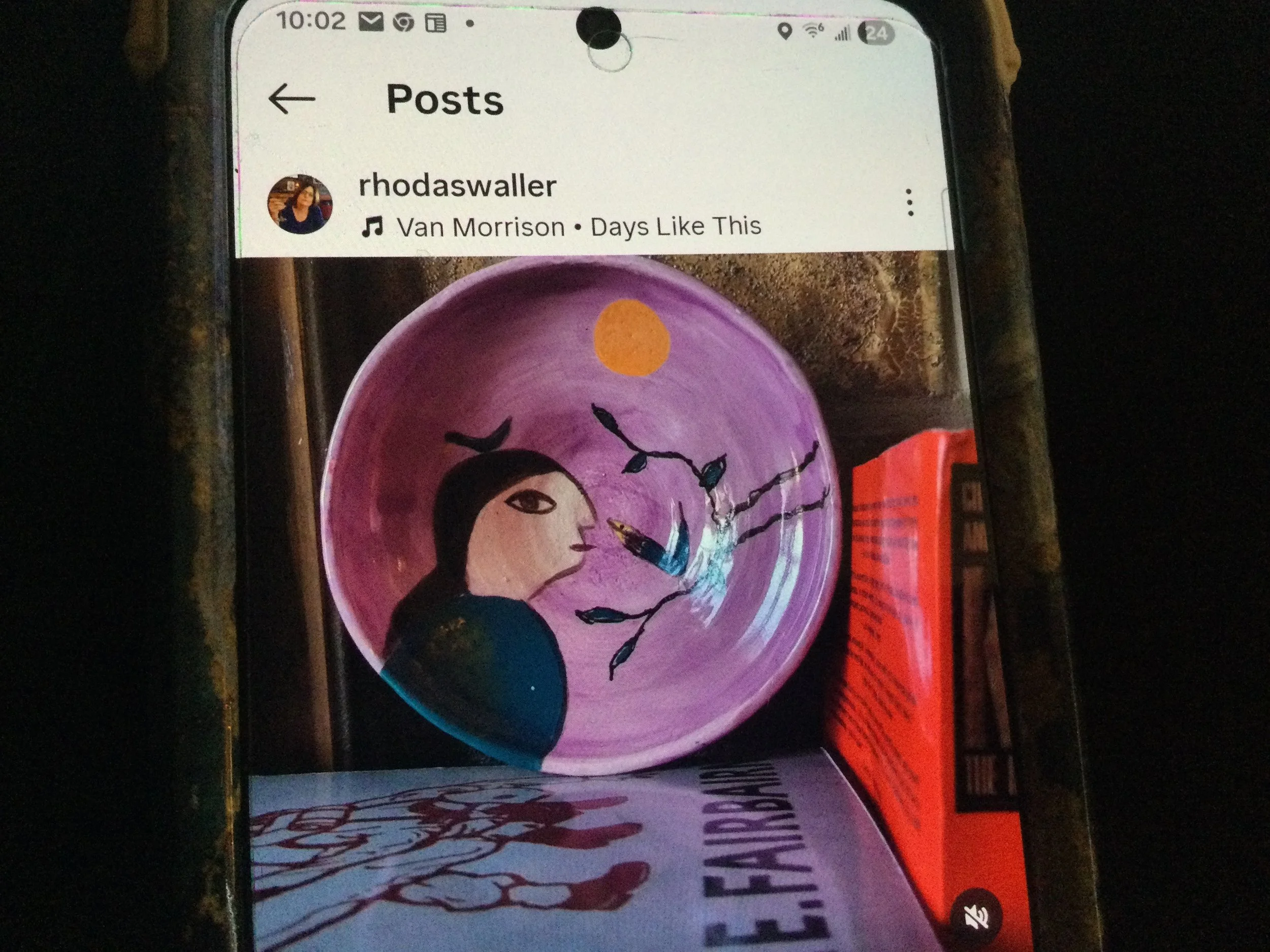 Purple ceramic dish with illustrated female figure and two birds on a branch