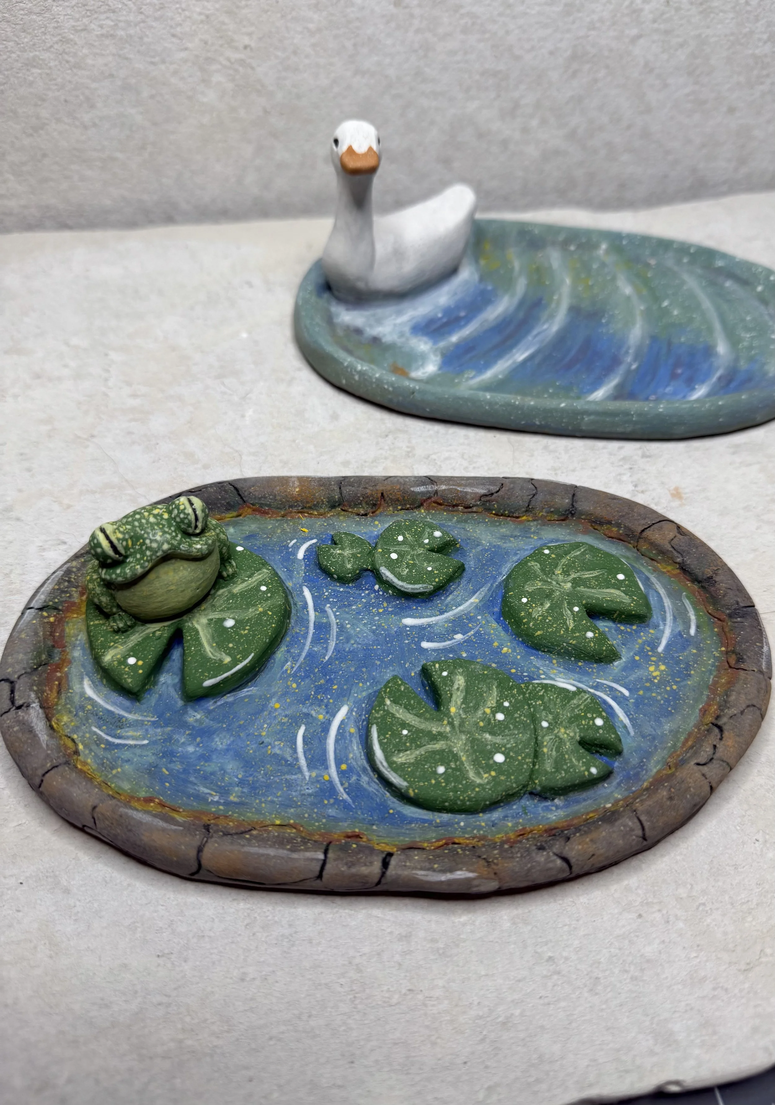 Two Ceramic ponds with frogs, lilypads, and a duck