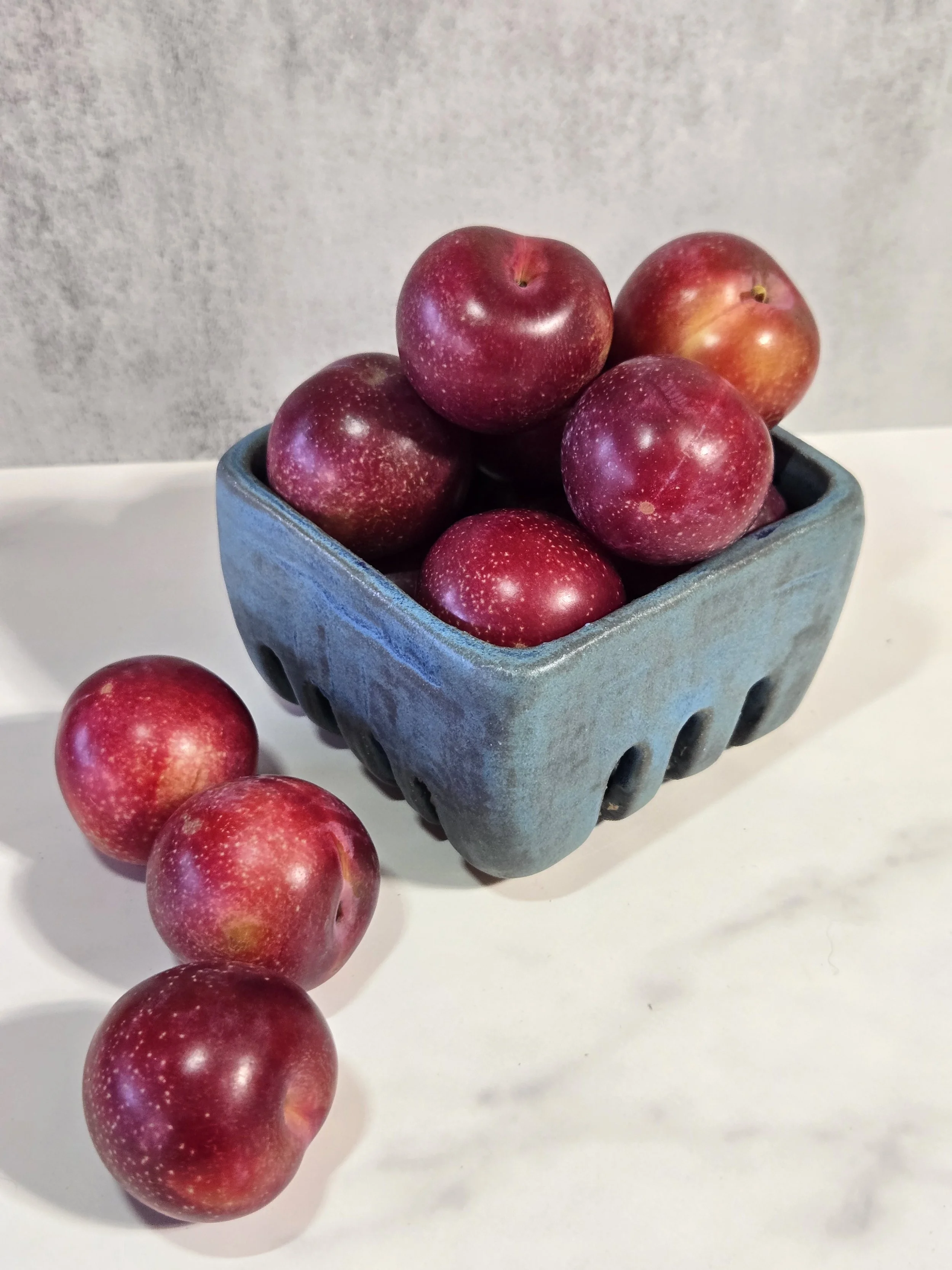 Ceramic fruit box with plums