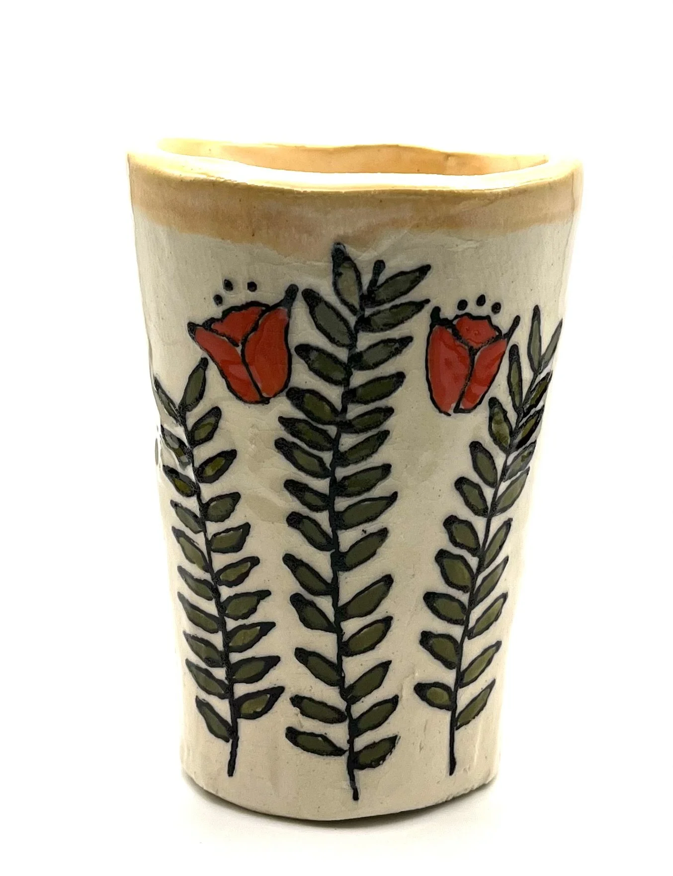 CLose up of a vase decorated with a vine and floral design