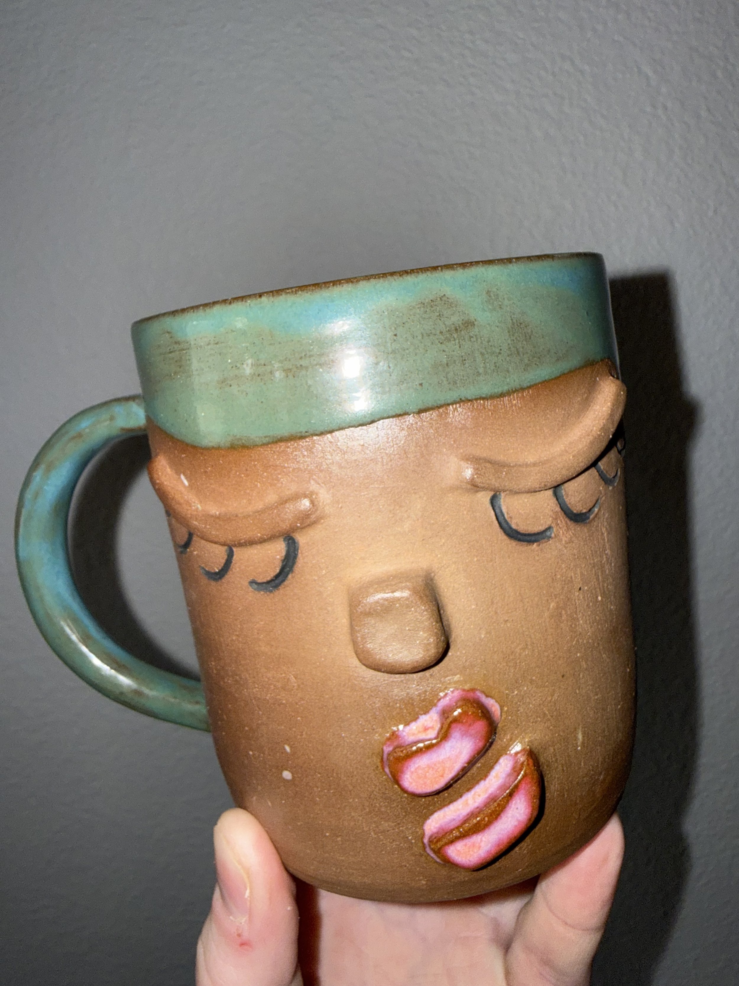 ceramic mug with 3-d facial features