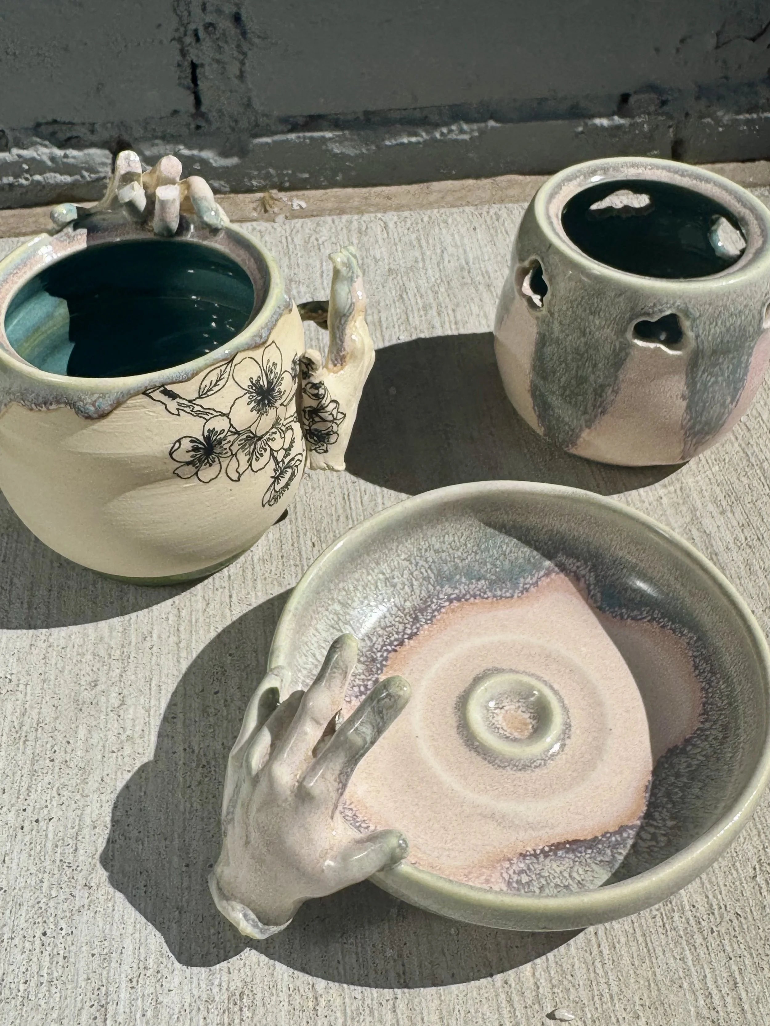 Ceramic dinner set with hands protruding