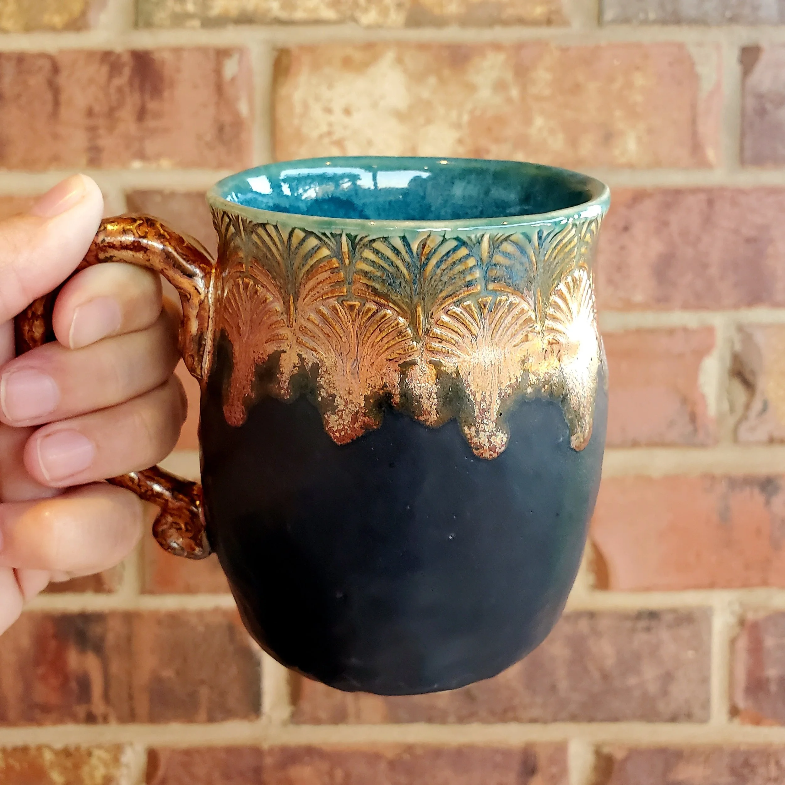 Black ceramic mug with patterned top