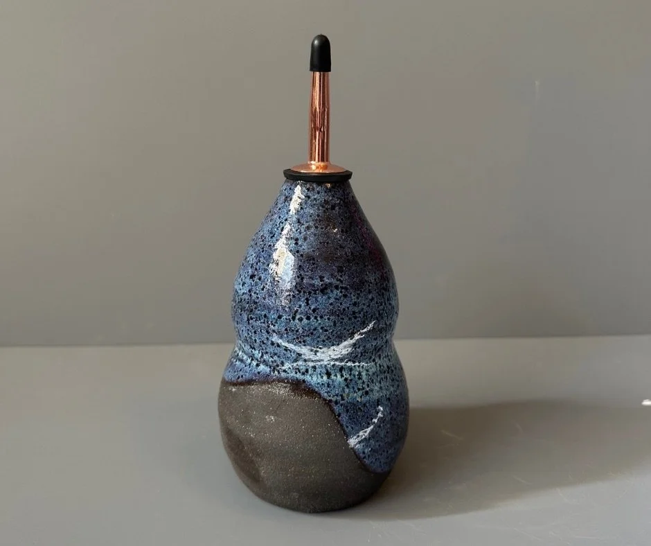 Ceramic oil bottle in black and blue glaze