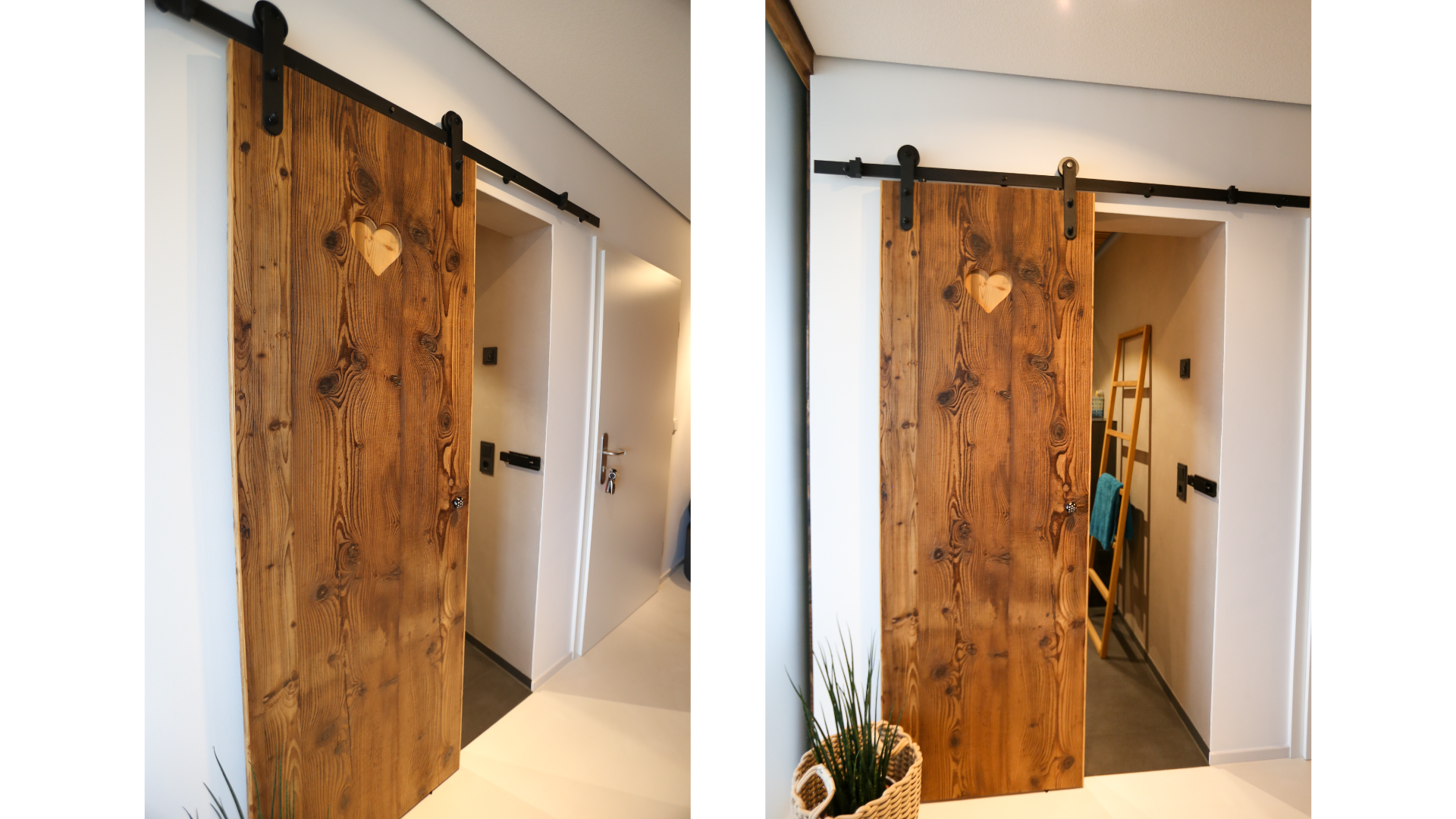 Ein holztür mit Herz-Schnittmuster auf einer schwarzen Schiene. Im Flur hinter der Tür sieht man einen Spiegelrahmen und einige Gegenstände.