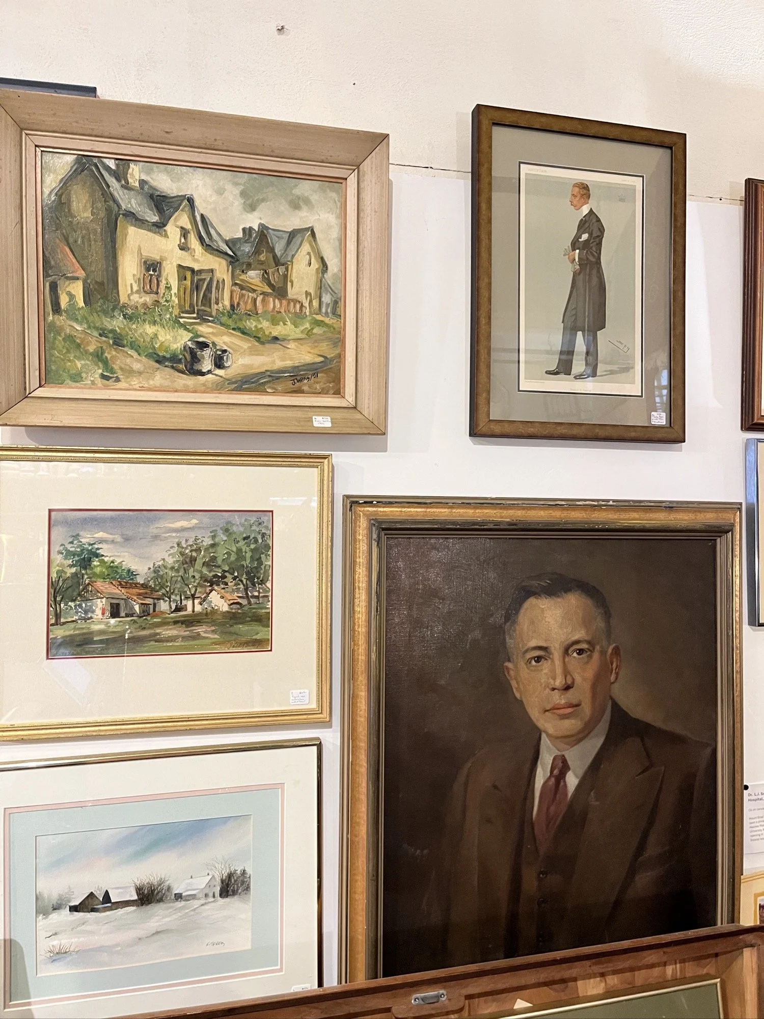 White bust with a suit and tie, set against a dark background.