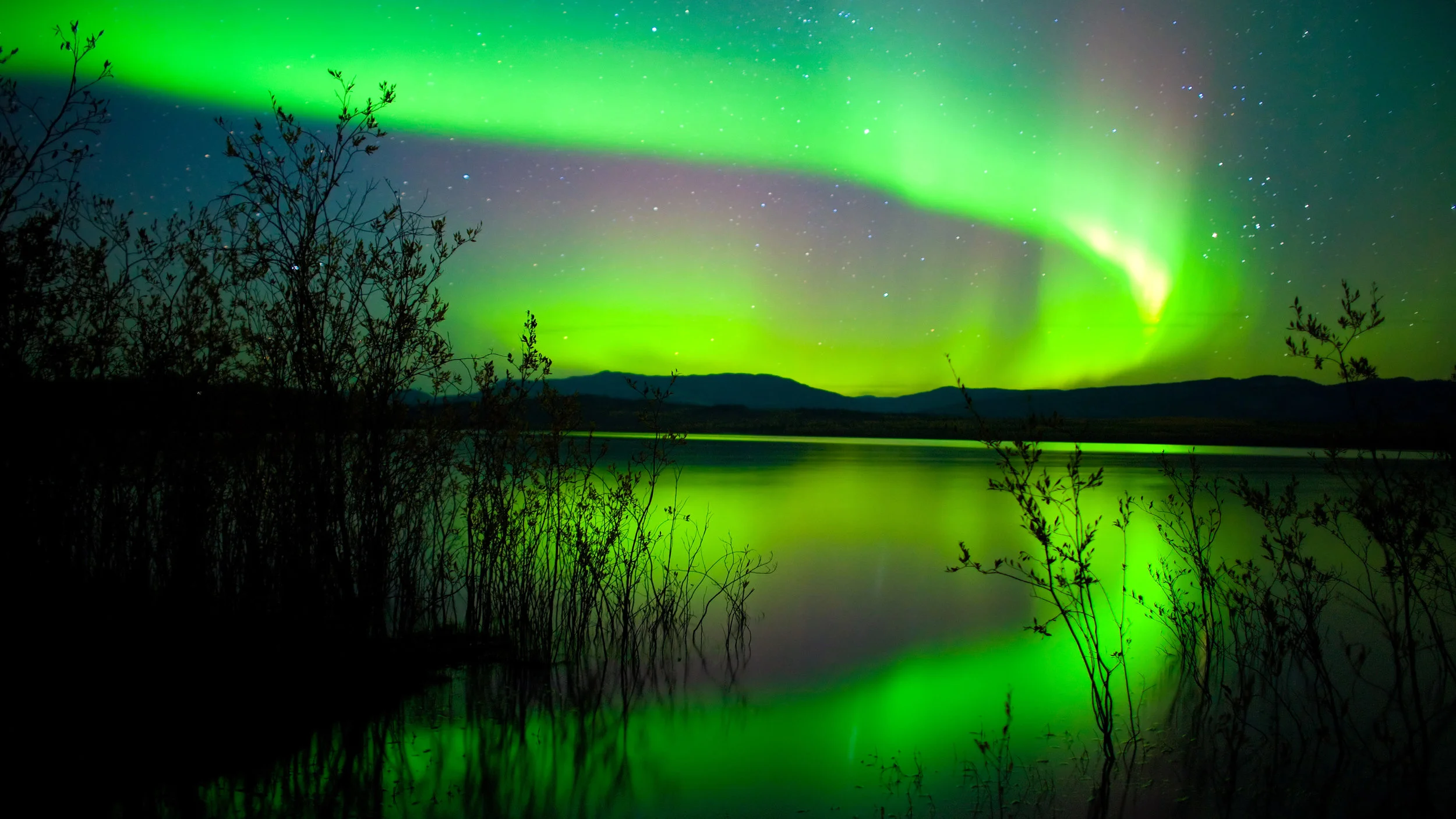 bigstock-Northern-Lights-Mirrored-On-La-10685066.jpg
