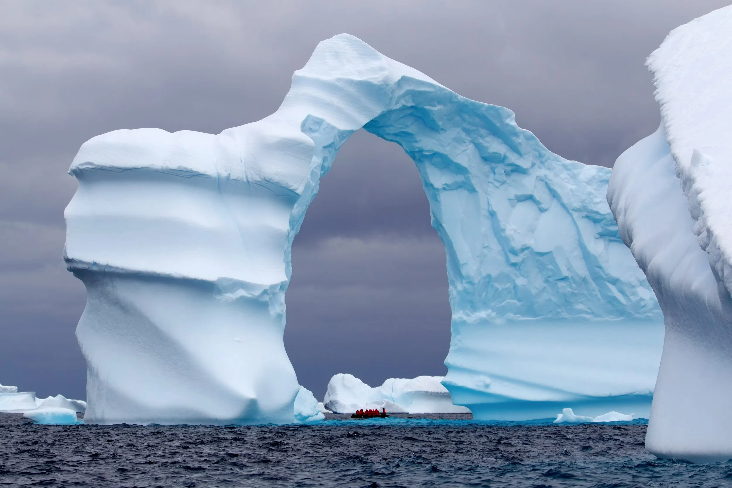 bigstock-Huge-Arch-Shaped-Iceberg-in-An-65261785.jpg