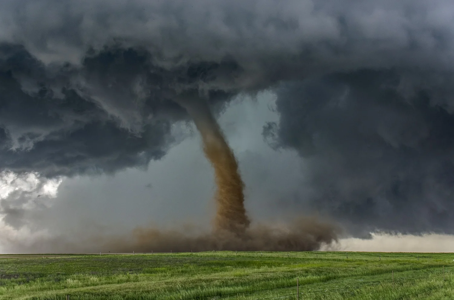 bigstock-Beautiful-tornado-over-a-green-93483716.jpg