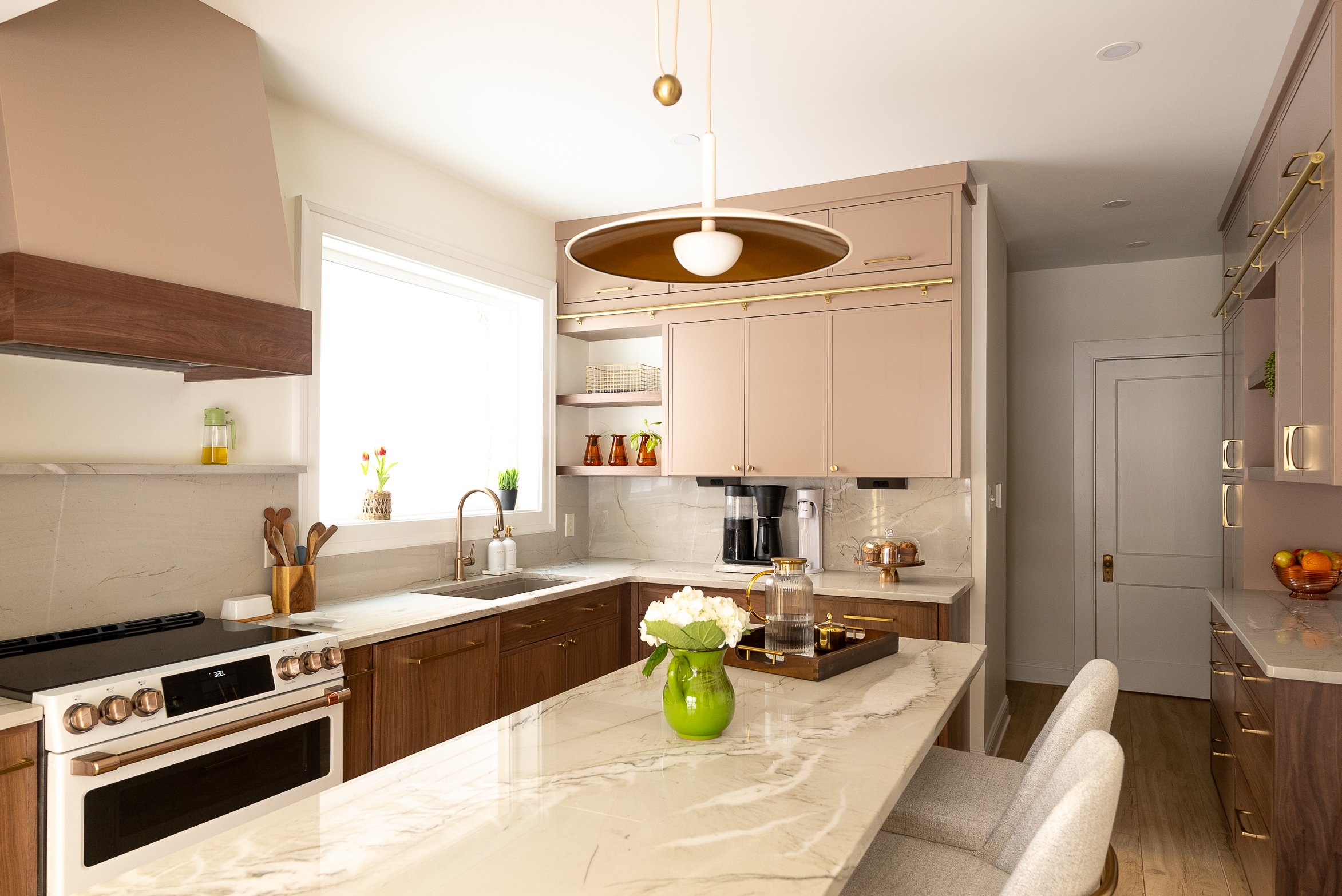 Schenley Farms Residence - The quartzite ledge and spice pull-outs alongside the range keep regularly used items readily available. Photo by KH Home Photos