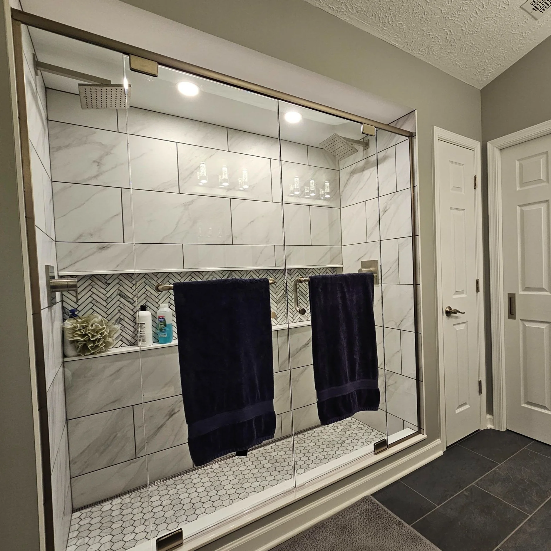Cranberry Primary Bath where we took an old, cramped tub/shower combo and turned it into this spacious shower for two!