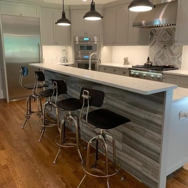 Oakland Kitchen Renovation featuring marble-front island with a high top bar for entertaining or quick meals. The beautiful Thermador appliances work wonderfully with storage and organization that make life easier for these homeowners.