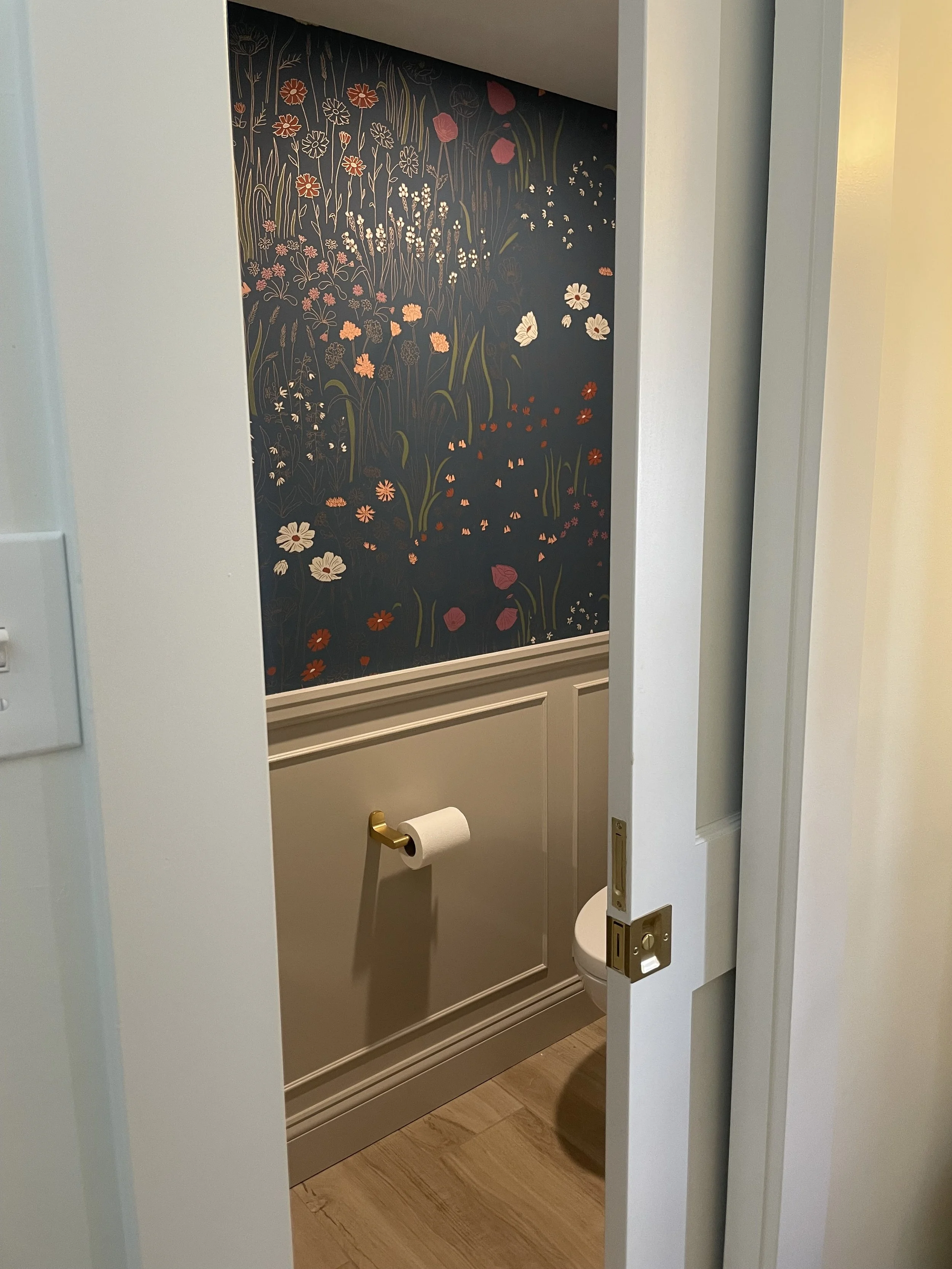 Schenley Farms Residence - We added this beautiful wallcovering along with painted millwork to give this little powder room a big impact. 