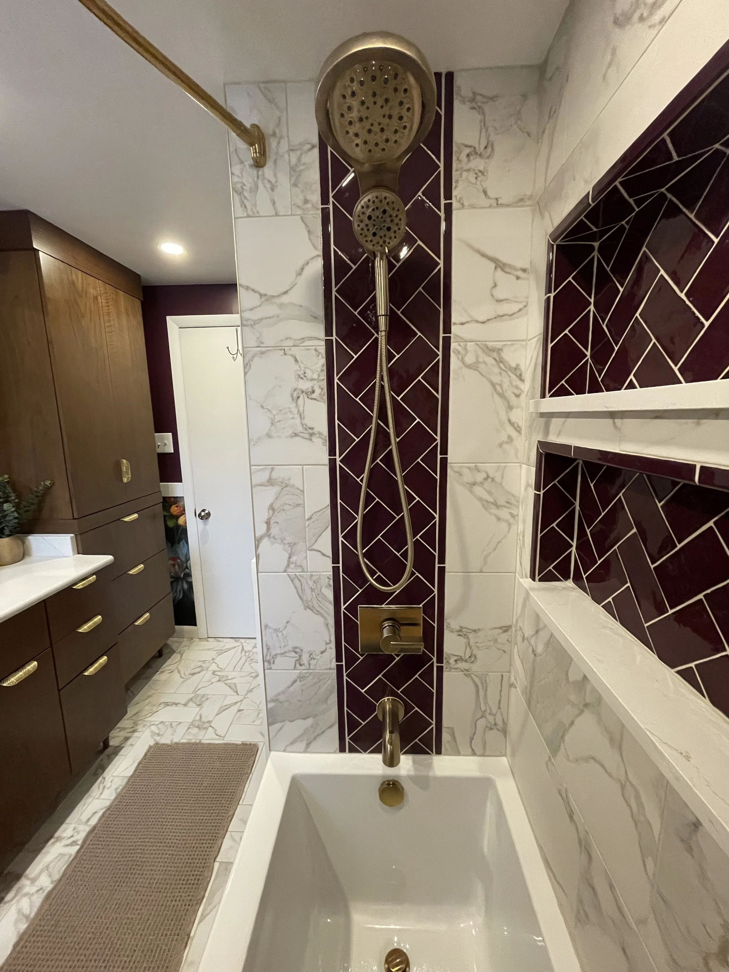 North Hills Primary Bath shower, where we combined a timeless field tile with the bold purple accent. The custom linen tower is peeking there also!